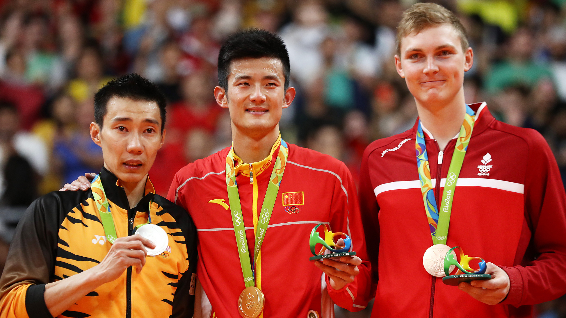 China's Chen Long (center) won Olympic gold in 2016 with Axelsen (right) finishing third in Brazil. /Sean M. Haffey/Getty/CFP