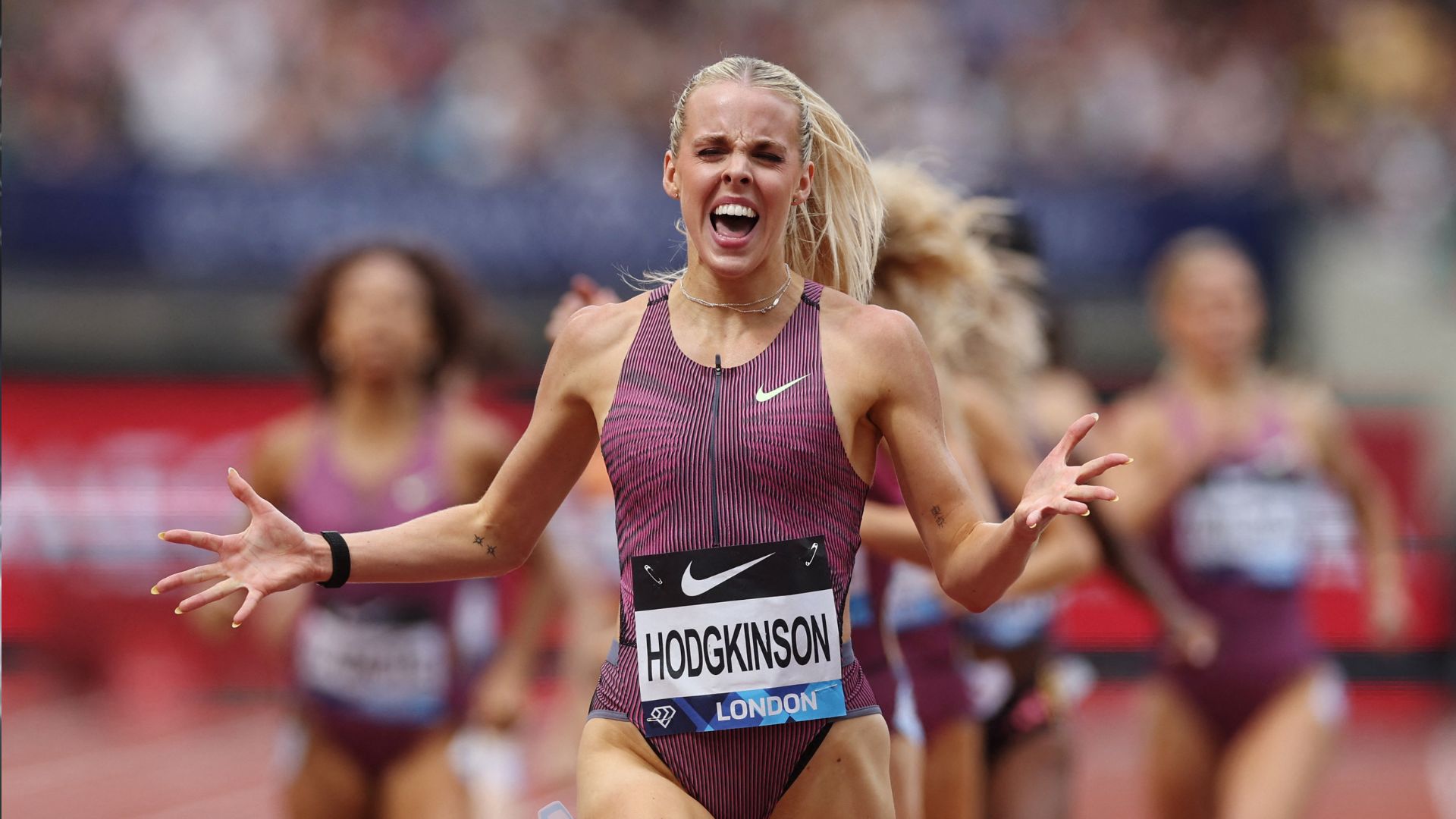 Keely Hodgkinson celebrates winning a warm-up race on July 20. /Paul Childs/Action Images via Reuters