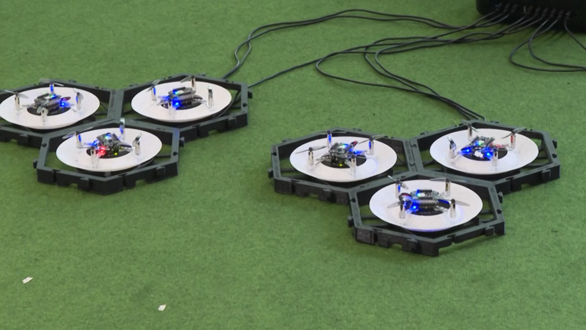 The drones can autonomously land on recharging pads. /AFP