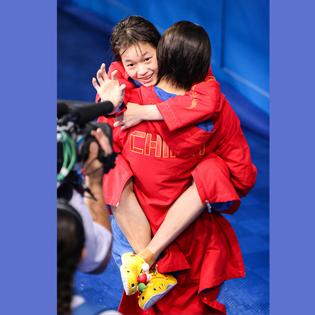 Chinese diving gold medalist Quan Hongchan celebrates. /CFP Photo