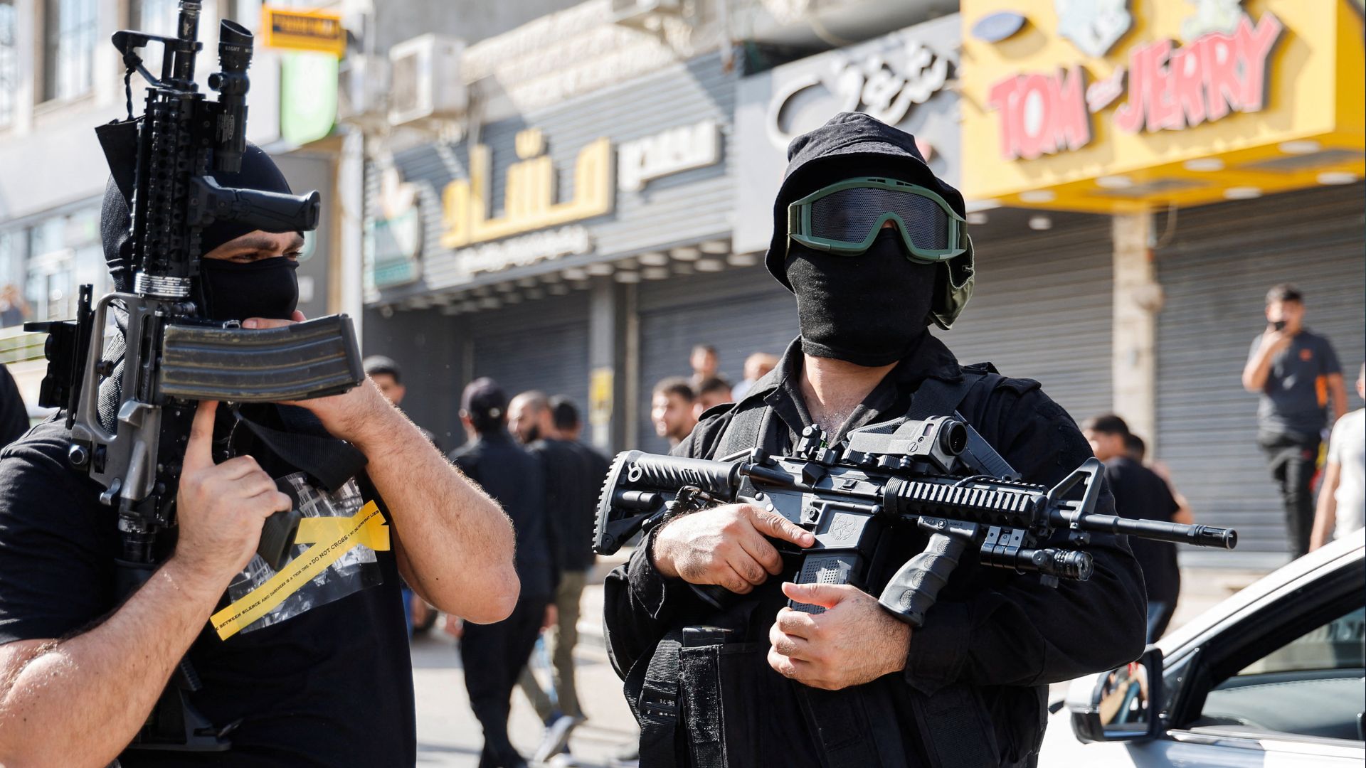 Palestinian gunmen attend a funeral on Wednesday for four Palestinian militants, who were killed in the Israeli-occupied West Bank. /Raneen Sawafta/Reuters