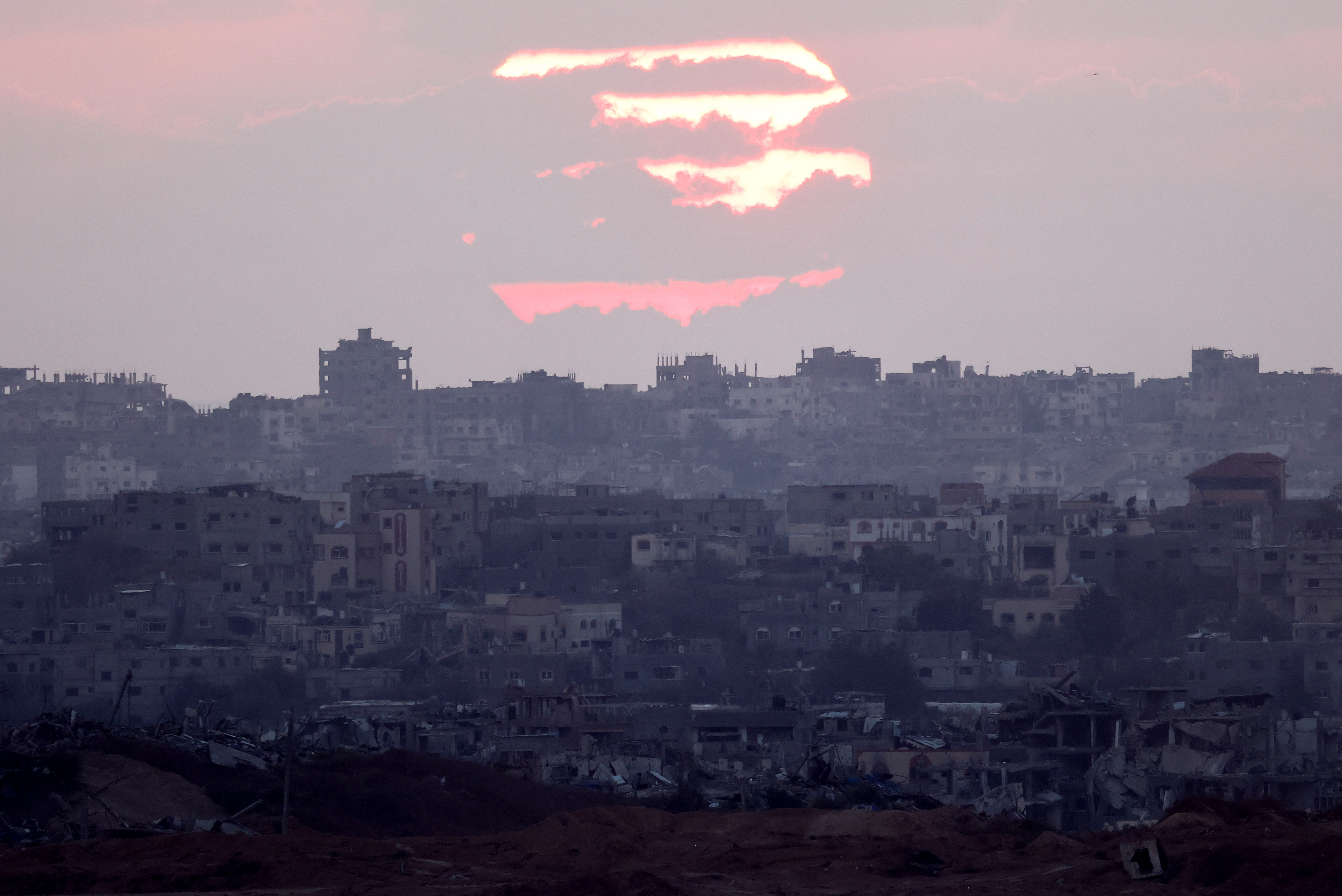 A view of Gaza during sunset, amid the Israel-Hamas conflict, near the Israel-Gaza border, as seen from Israel. /Amir Cohen/Reuters