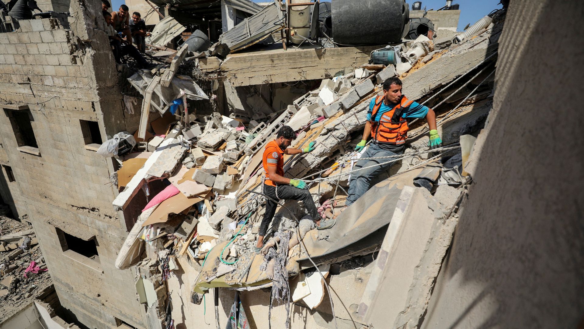 Rescuers work to recover bodies after an Israeli strike in Gaza City. /Dawoud Abu Alkas/Reuters