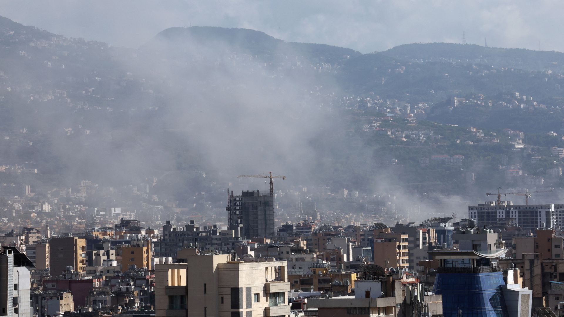 Smoke rises from Beirut southern suburbs on Friday. /Mohamed Azakir/Reuters