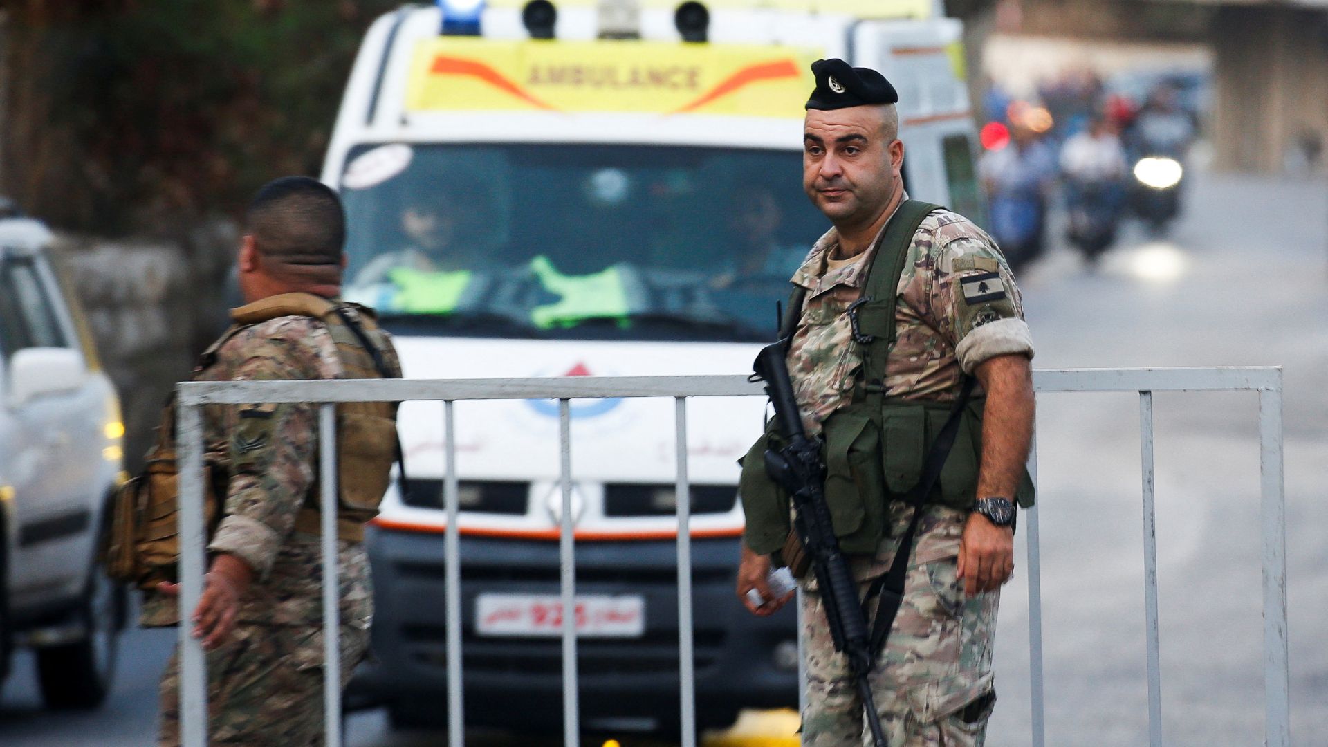 Lebanese army members stand next to an arriving ambulance outside of a hospital, after an Israeli strike in the southern suburbs of Beirut. /Amr Abdallah Dalsh/Reuters