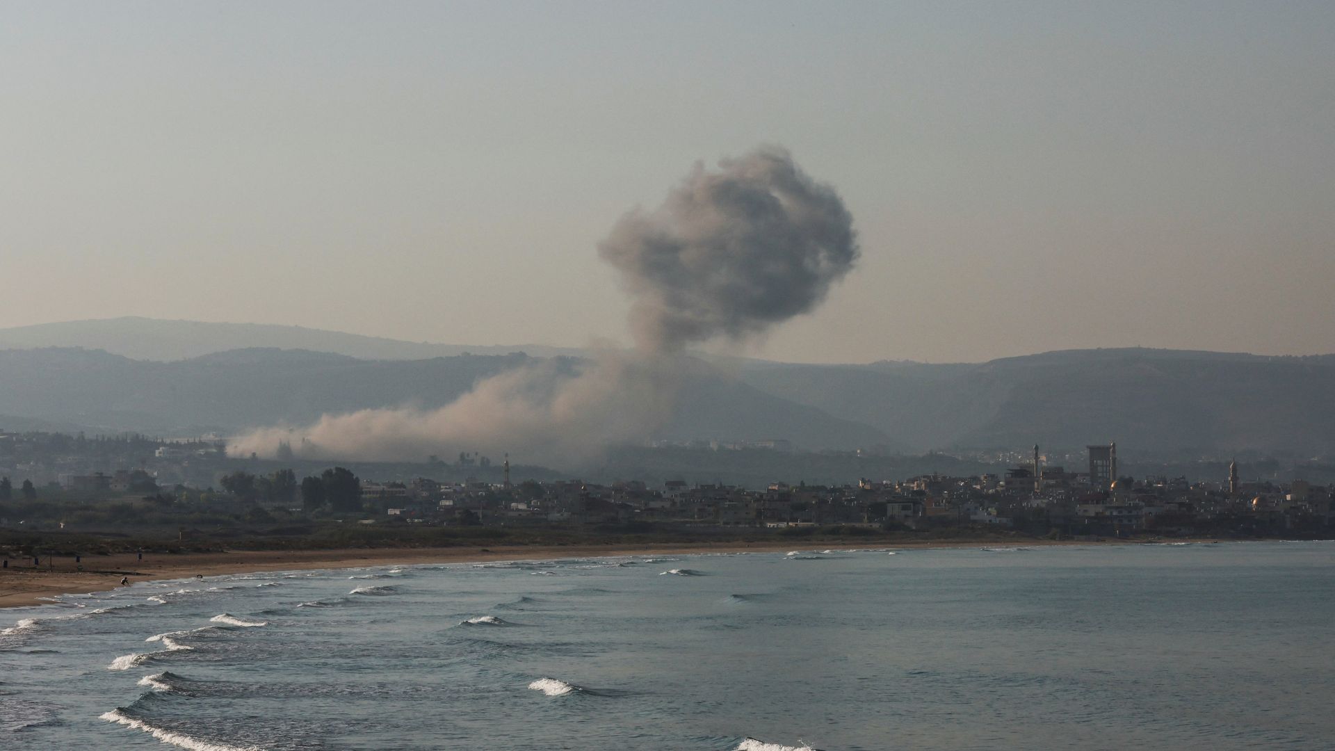 Smoke billows over southern Lebanon following an Israeli strike, as seen from Tyre. /Aziz Taher/Reuters