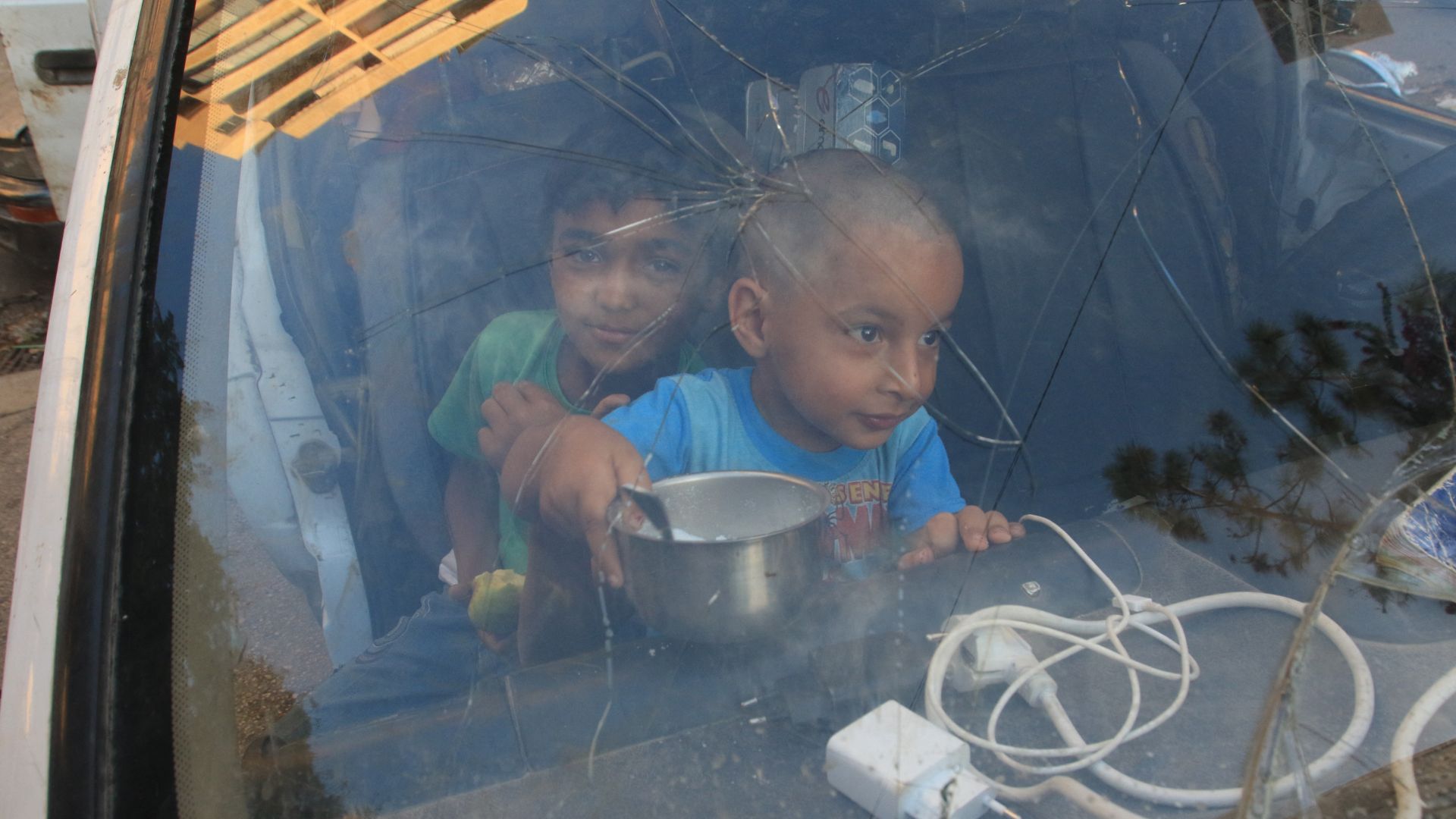 Lebanese children, who fled with their family from their village in southern Lebanon, sit inside a truck upon their arrival to seek refuge at a public school in the Sidon. /Mahmoud Zayyat/AFP
