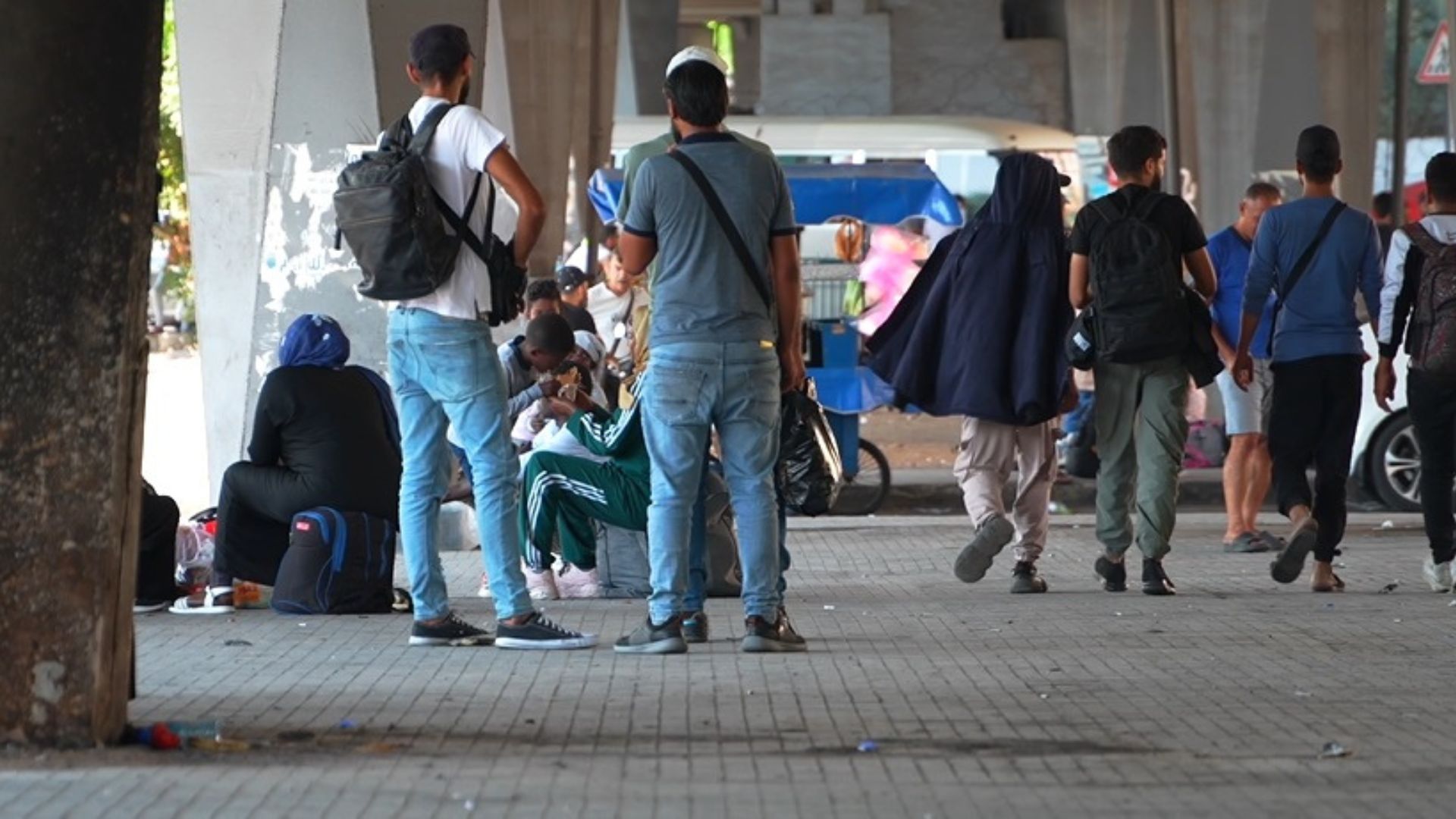 Spaces under bridges have turned into makeshift shelters for people fleeing southern Lebanon. /CGTN