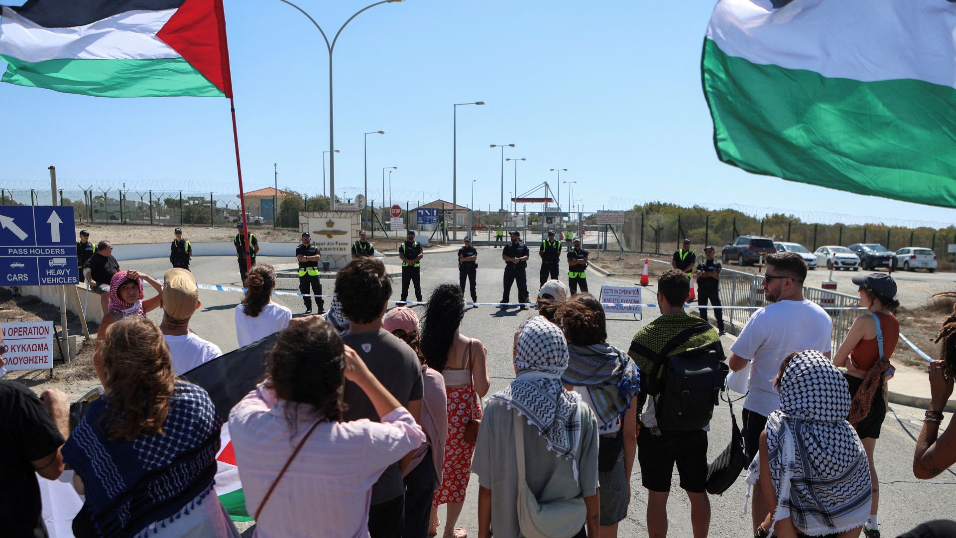 Activists demonstrate against the escalating crisis in the Middle East outside a British military base in Cyprus. /Elias Marcou/Reuters