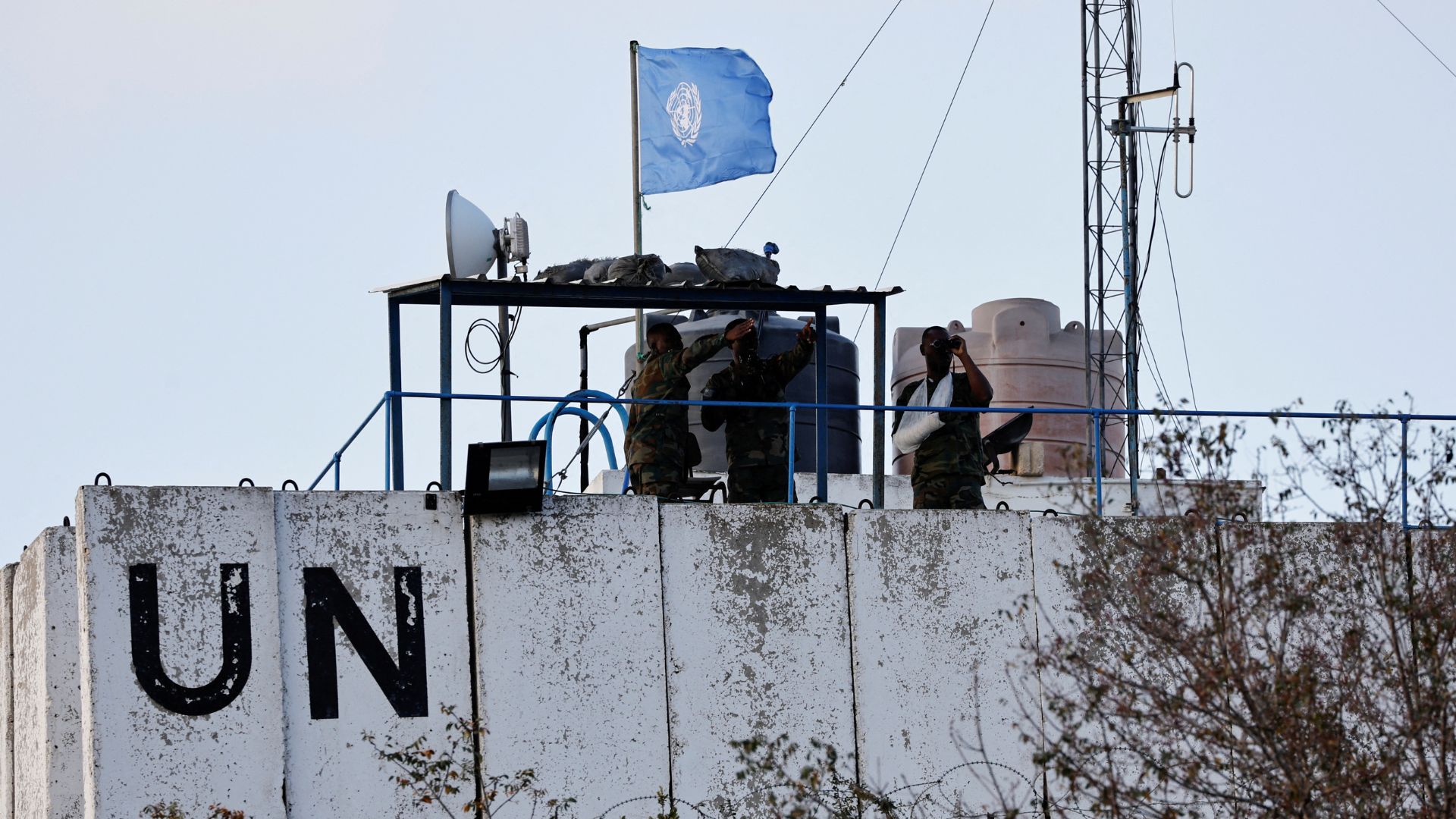 UNIFIL members observe the Lebanese-Israeli border from a watchtower ‏in Marwahin, southern Lebanon./Thaier Al-Sudani/Reuters