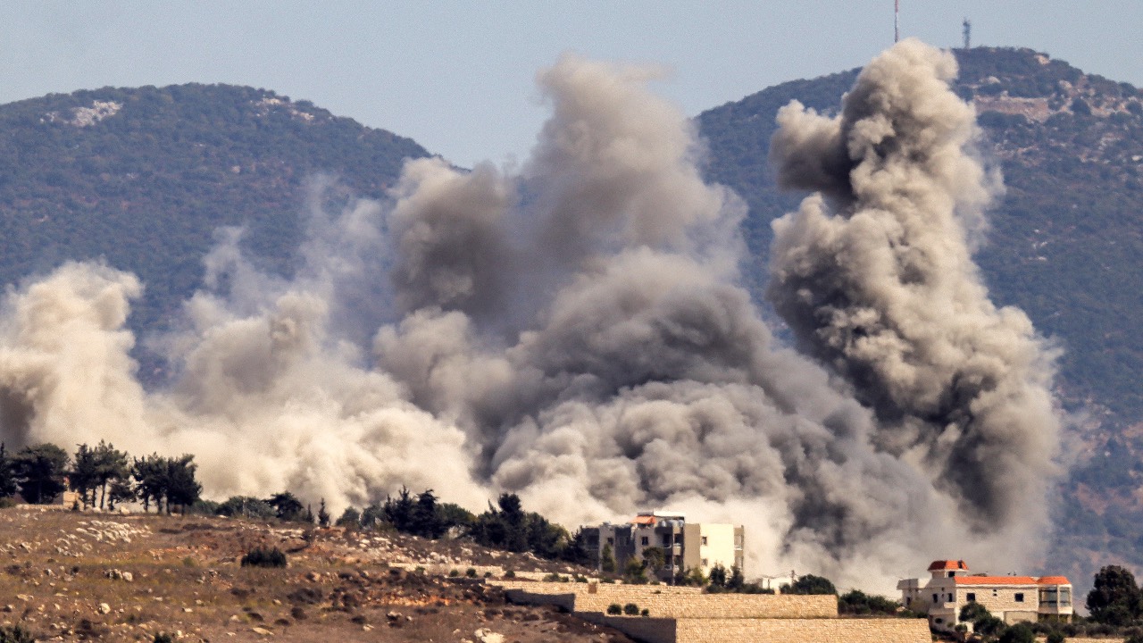 Smoke clouds erupt during an Israeli airstrike on Khiam in southern Lebanon near the border with Israel. /AFP