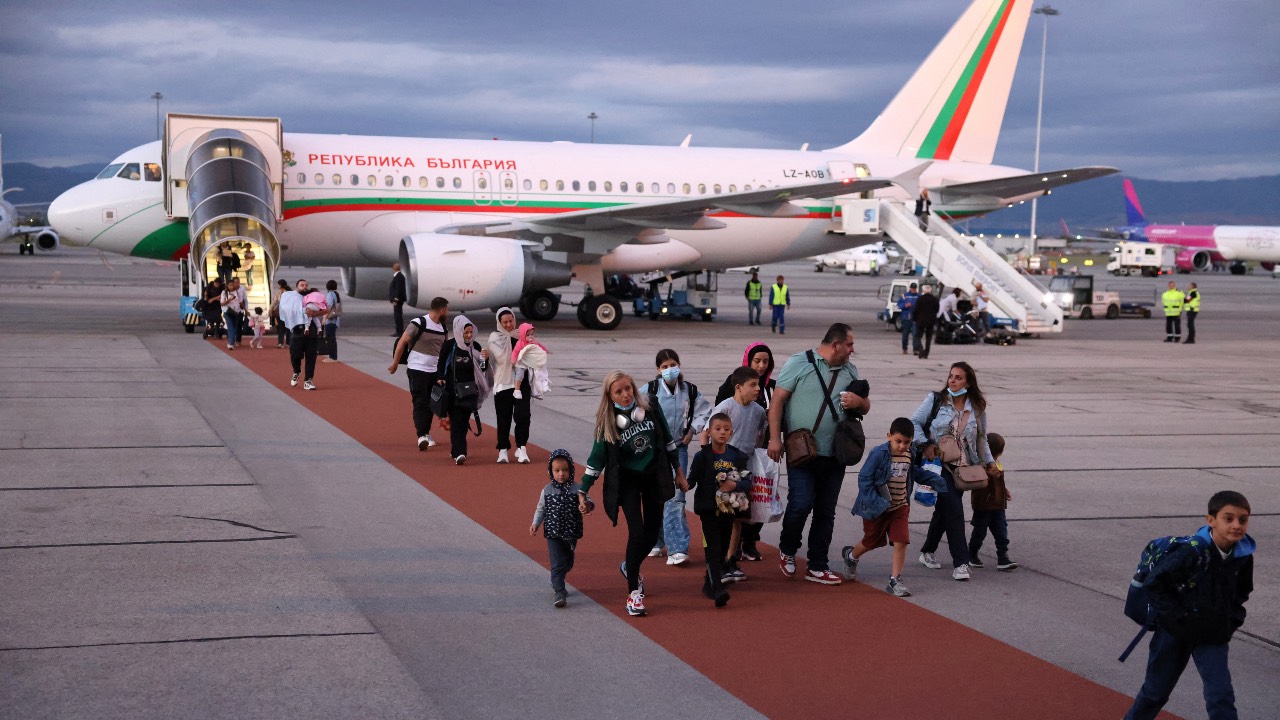 People disembark from a Bulgarian government plane following its arrival from an evacuation flight from Lebanon, at Sofia airport. /Stoyan Nenov/Reuters