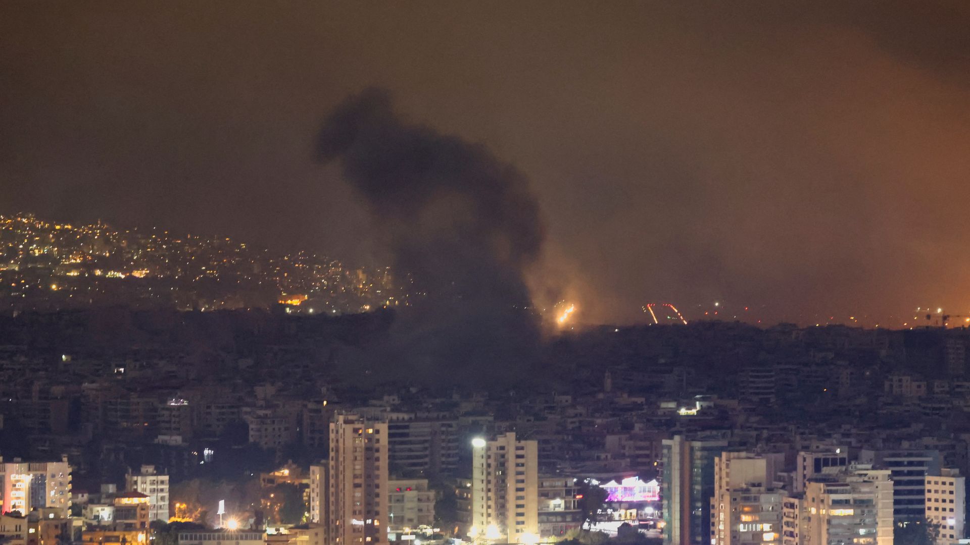 Smoke billows over Beirut southern suburbs after a strike, as seen from Sin El Fil, Lebanon. /Mohamed Azakir/Reuters
