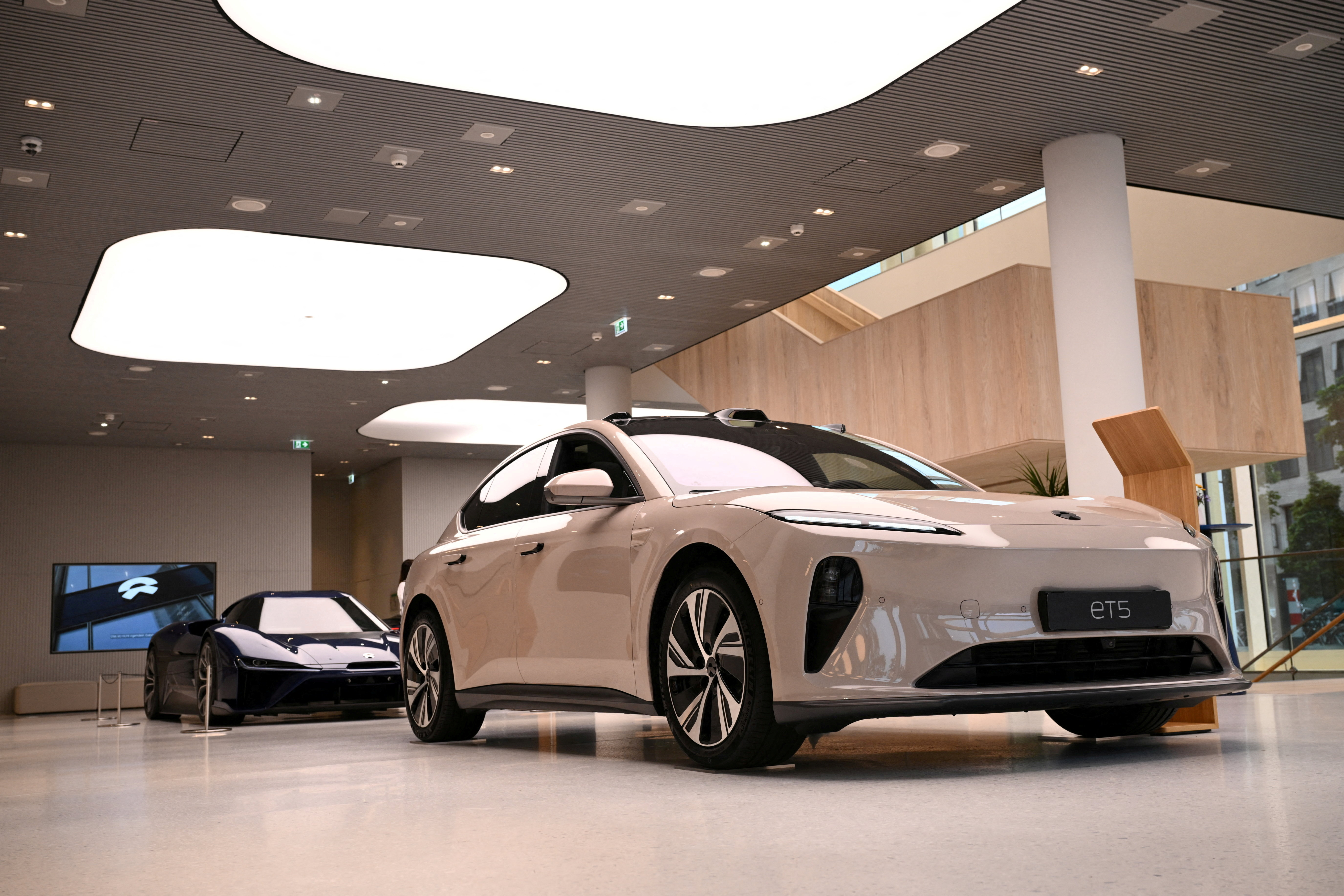 A NIO ET5 car model and the NIO EP9 sports car at the showroom of the Chinese premium smart electric vehicle manufacture in Berlin. /Annegret Hilse/Reuters