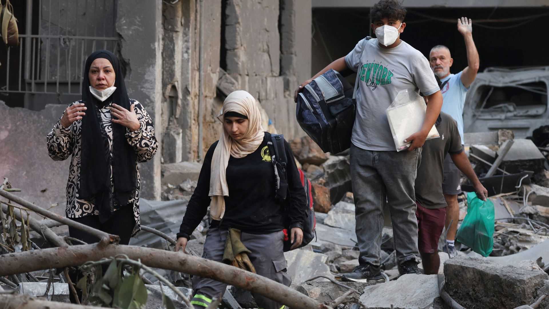 People inspect the damage at the site of an Israeli strike in Beirut. /Mohamed Azakir/Reuters