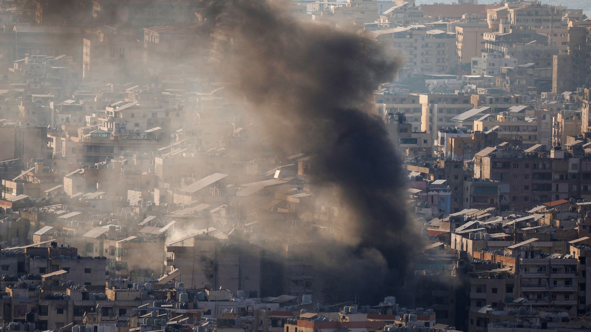 Smoke rises over Beirut's southern suburbs from a generator that caught fire, according to residents. /Louisa Gouliamaki/Reuters