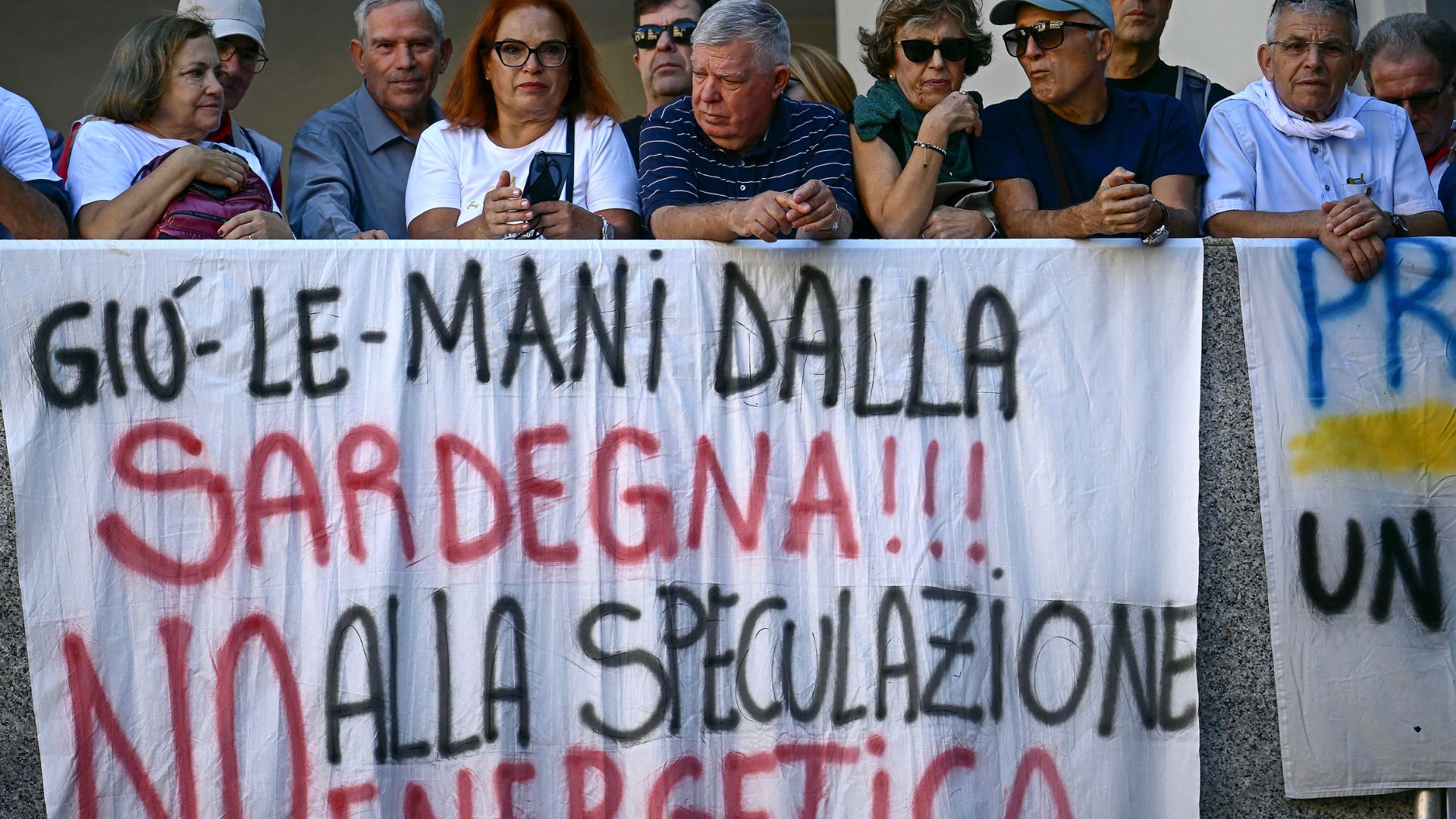 A banner reading 'Hands off Sardinia, No to energy speculation' at a protest in Cagliari. /Filippo Monteforte/AFP