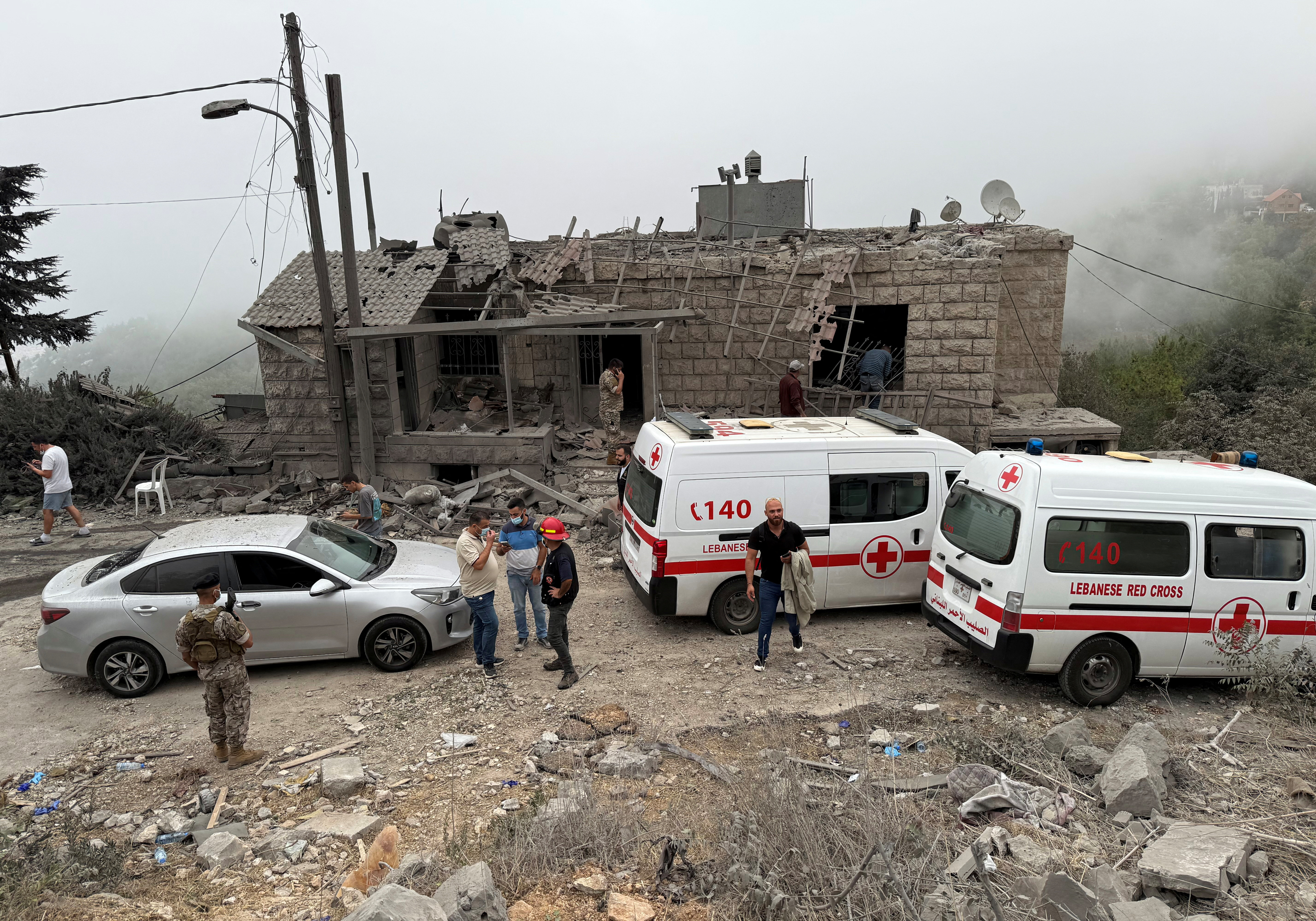 Lebanese Red Cross vehicles parked at a site apparently damaged by an Israeli air strike in the Christian-majority region of Aitou in north Lebanon. /Omar Ibrahim/Reuters