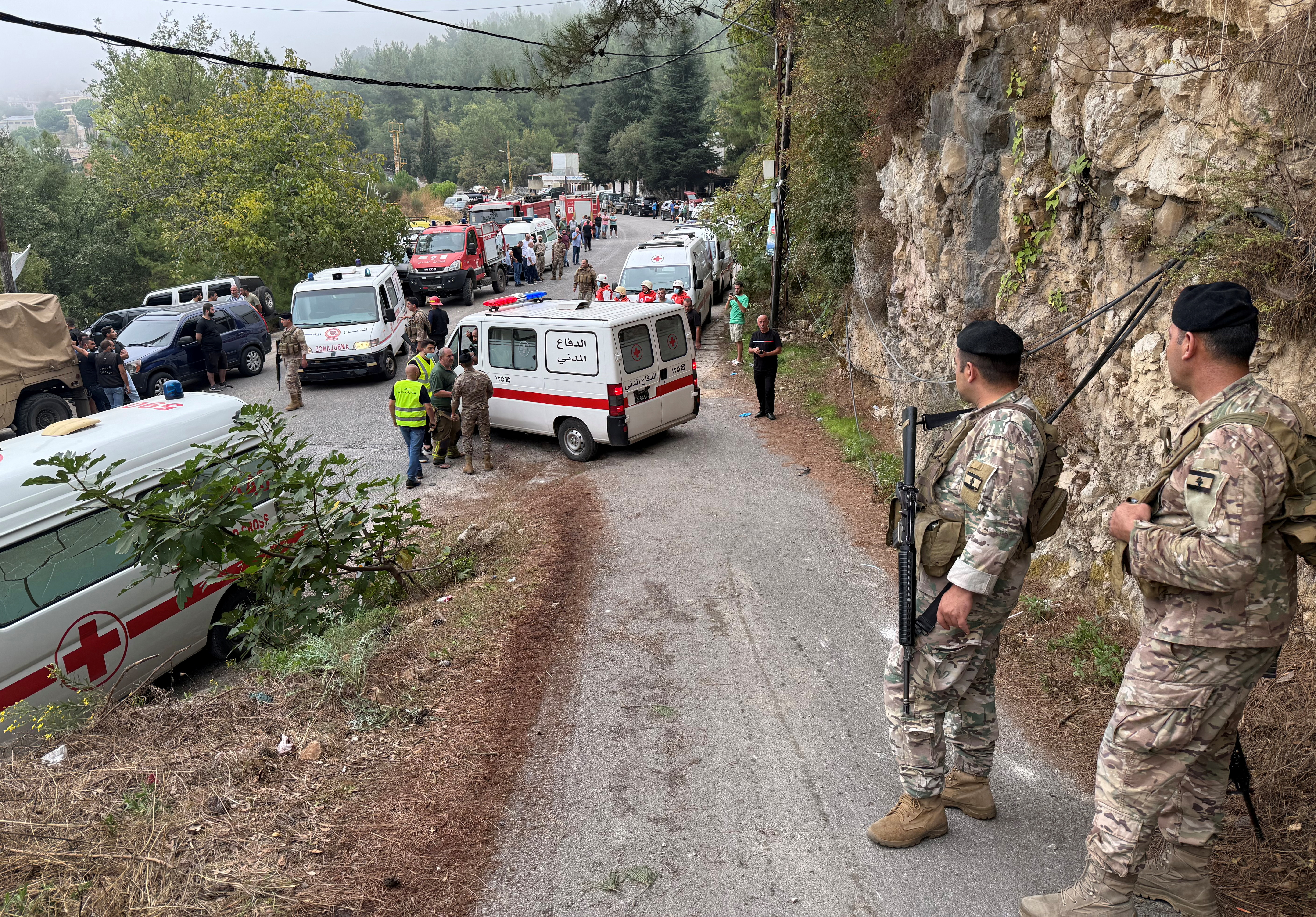 Lebanese army soldiers stand guard near a site of the Israeli air strike in Aitou. /Omar Ibrahim/Reuters