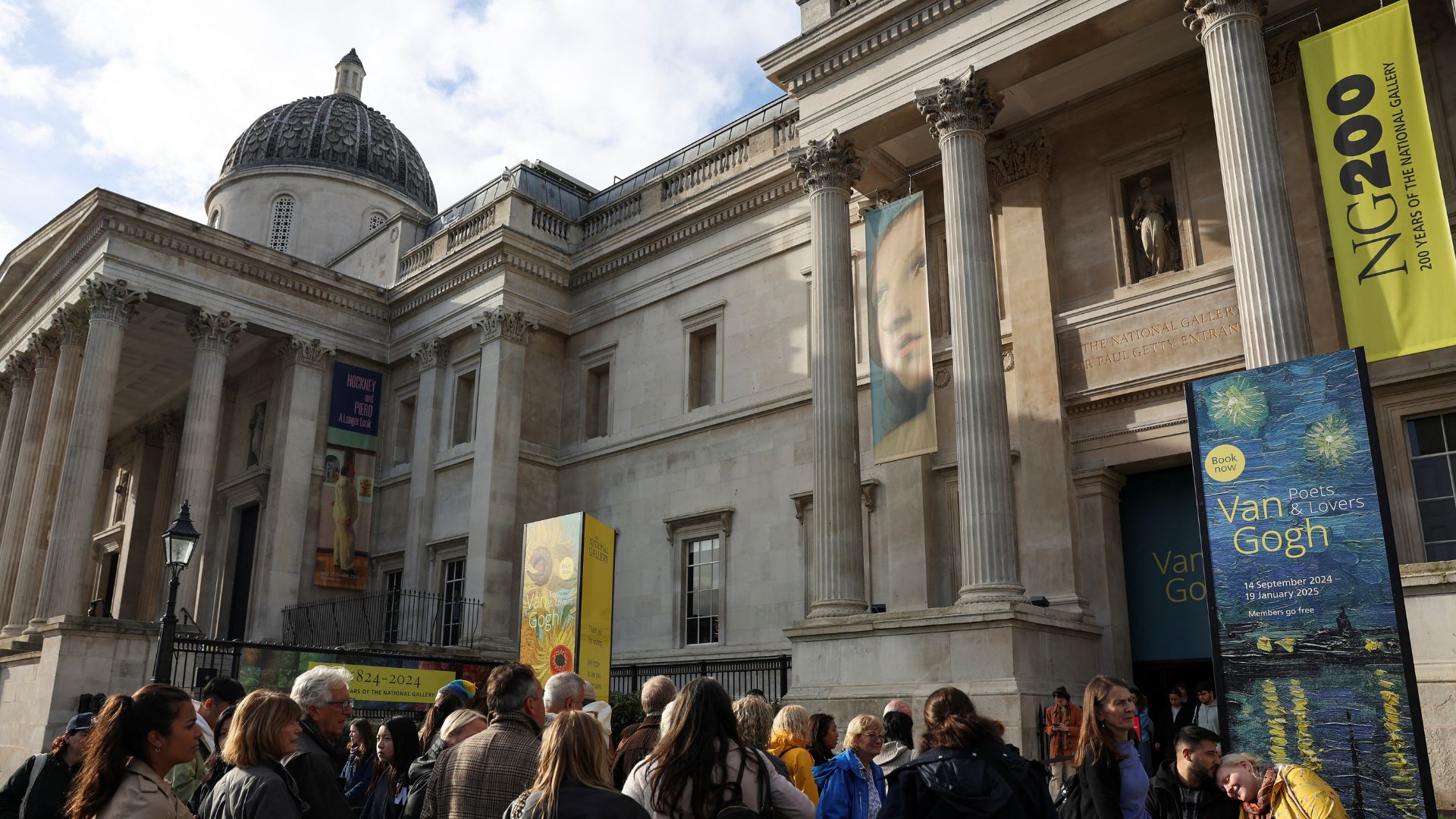 People at the National Gallery on the day of sentencing for the activists who threw soup at 'Sunflowers.' /Isabel Infantes/Reuters
