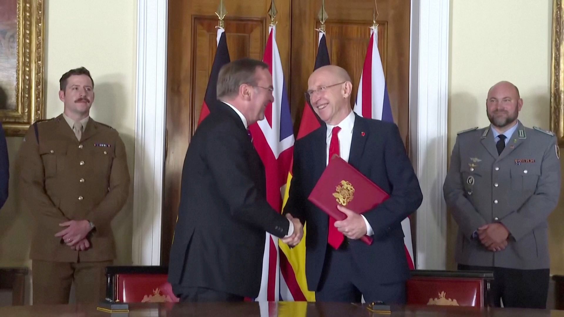 Germany Defense Minister Boris Pistorius (L) and his UK counterpart John Healey sign the deal in London. /Reuters