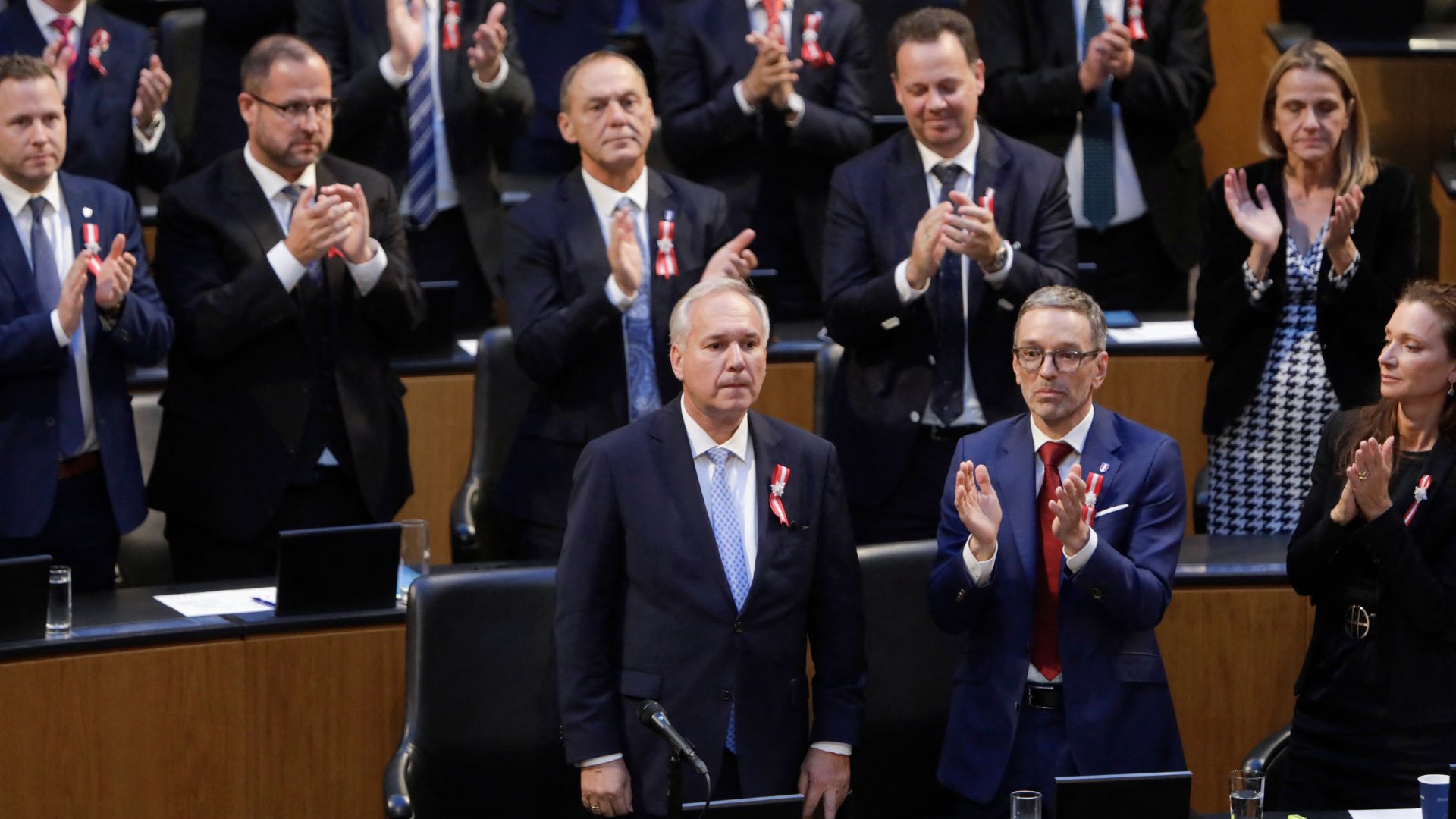 The chairman of Austria's Freedom Party (FPOe), Herbert Kickl, and other MPs applaud as Rosenkranz is elected. /Alex Halada/AFP
