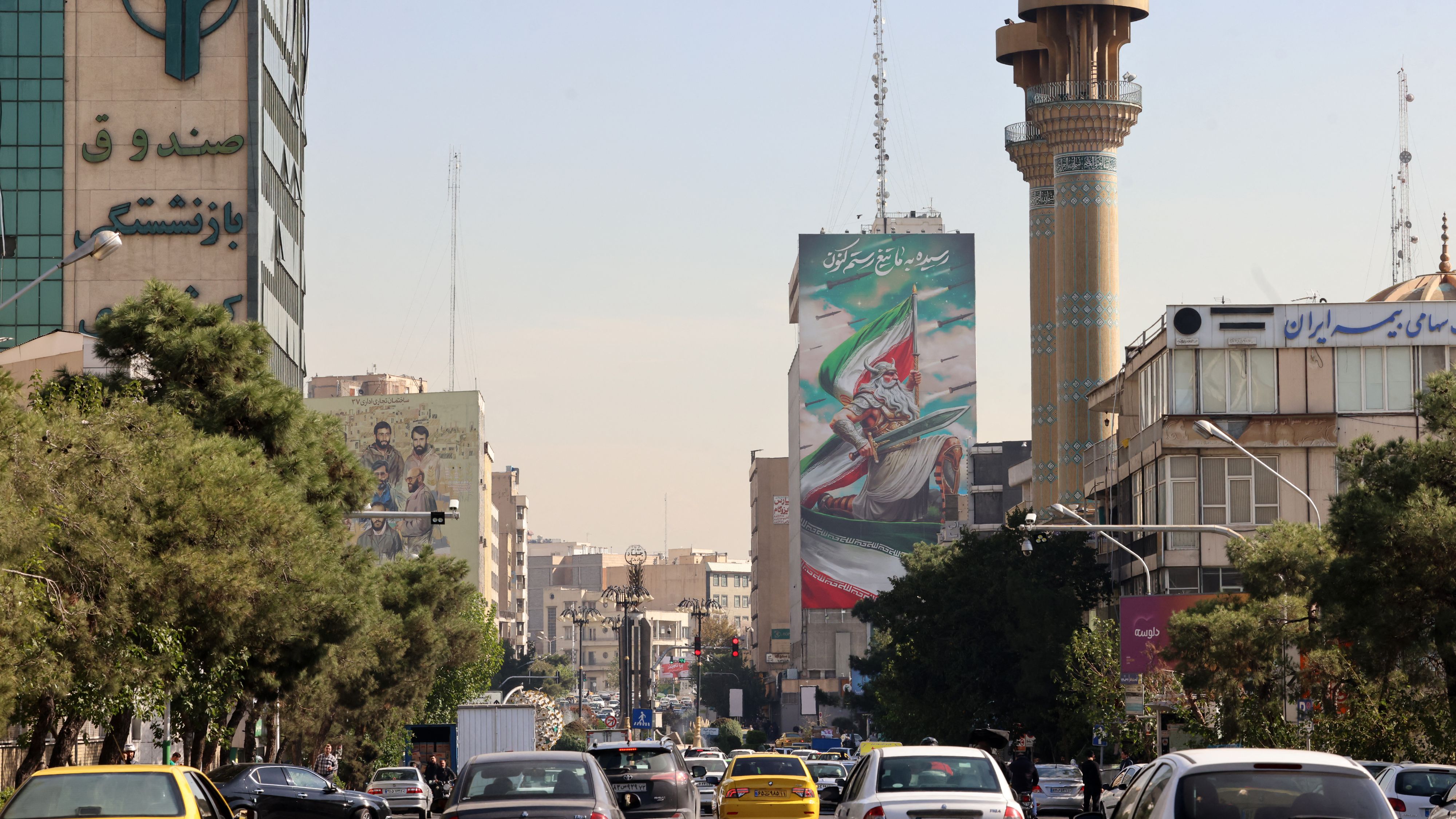 Tehran commuters returned to business on Saturday after a night of attacks. /Atta Kenare/AFP 