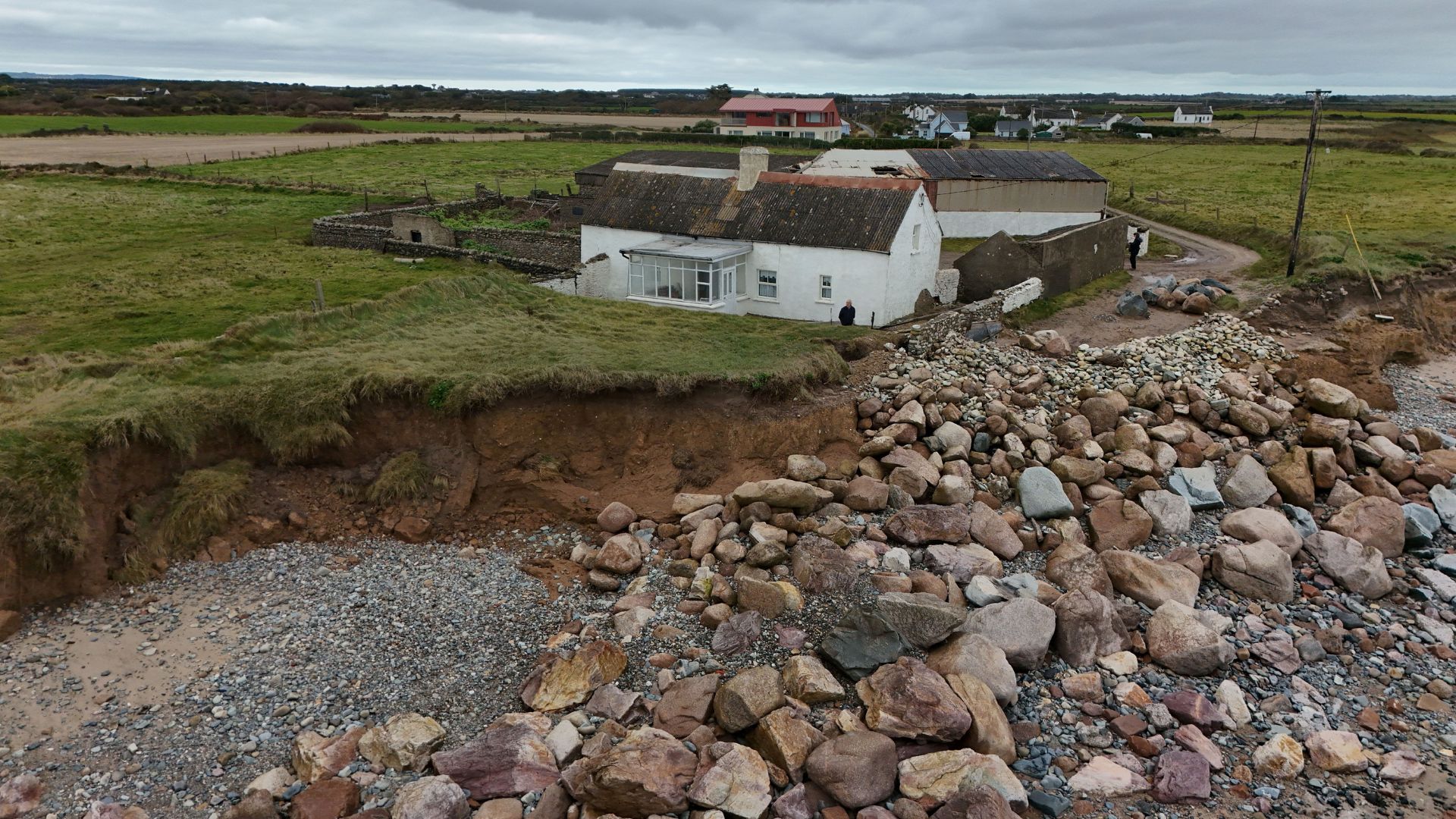 The family have piled up rocks hoping to stave off coastal erosion for now. /Clodagh Kilcoyne/Reuters