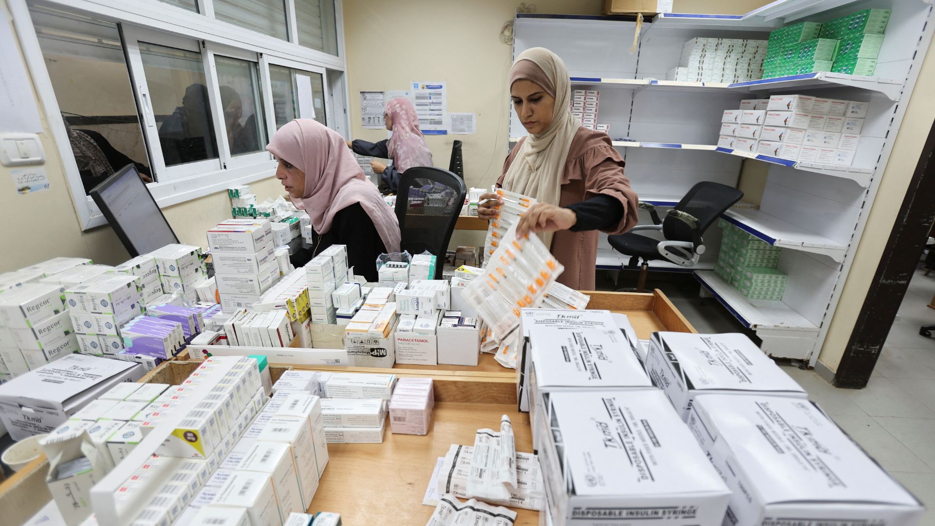 Staff work at a UNRWA-run health center in Deir Al-Balah, in the central Gaza Strip on Tuesday. /Ramadan Abed/Reuters
