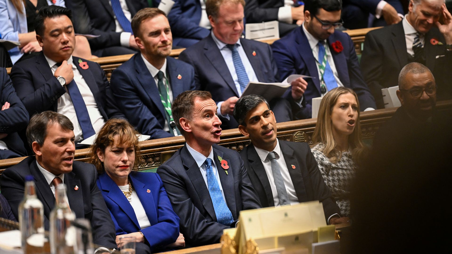 Former British Prime Minister Rishi Sunak and Shadow Chancellor of the Exchequer Jeremy Hunt react during the Chancellor's Budget Statement. /House of Commons/Handout