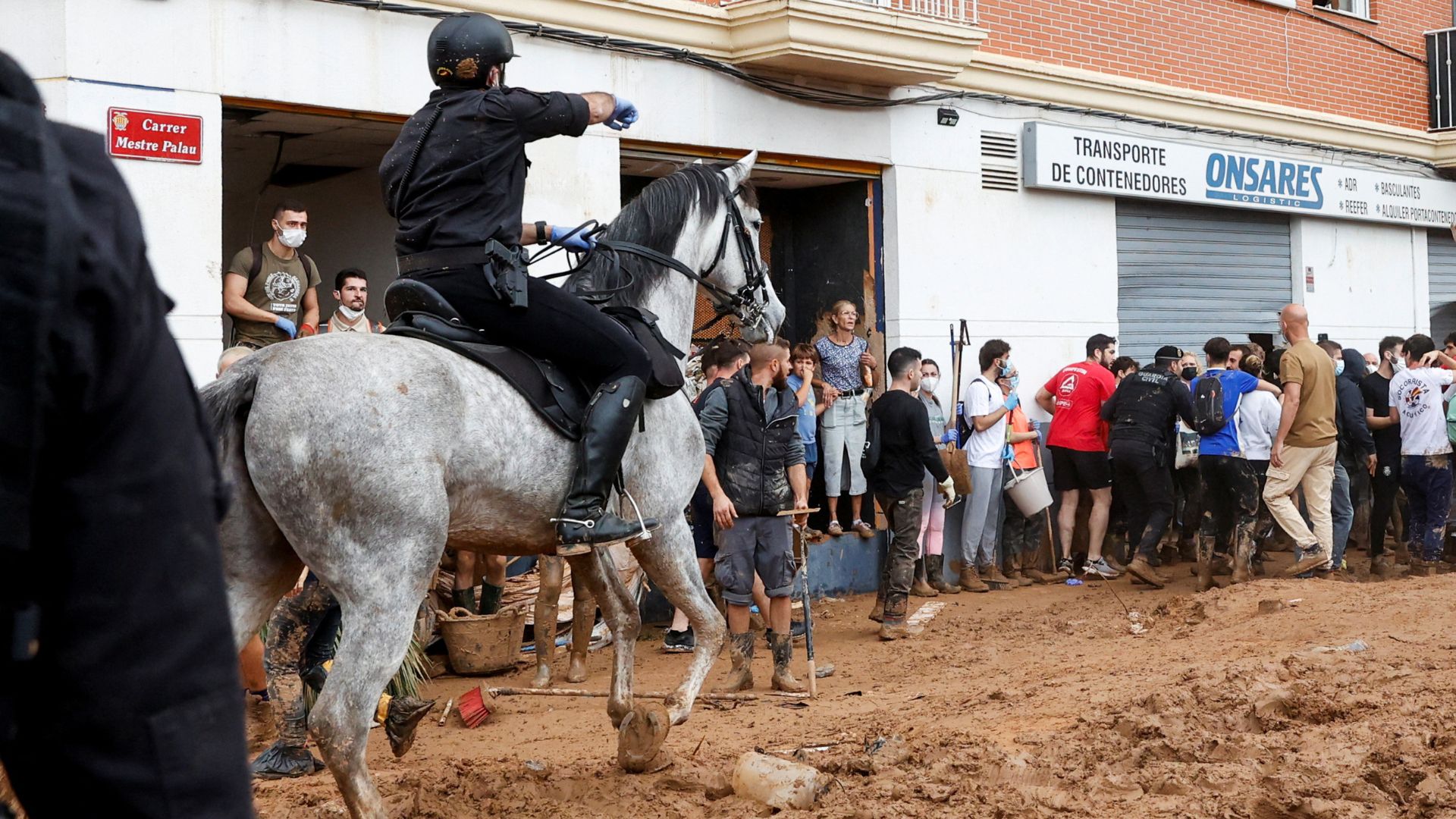 A member of the Spanish Civil Guard patrols as people protest. /Eva Manez/Reuters