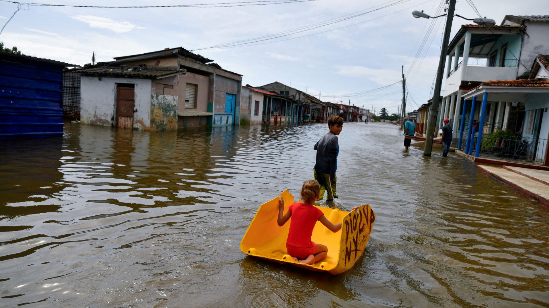 Children play on a flooded street as Hurricane Milton passes close to the Cuban coast, in Batabano, Cuba. /Norlys Perez/Reuters
