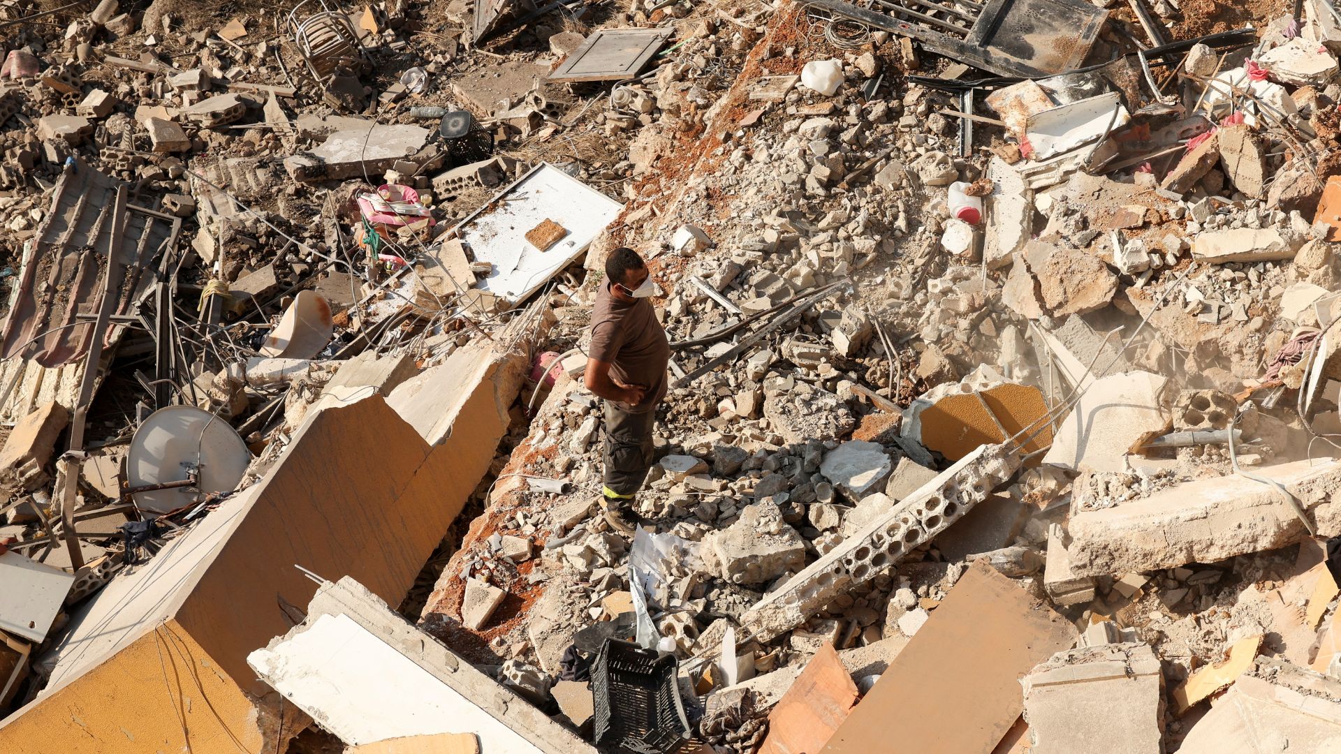 A civil defense member at a site damaged after an Israeli strike in Barja, Lebanon. /Aziz Taher/Reuters