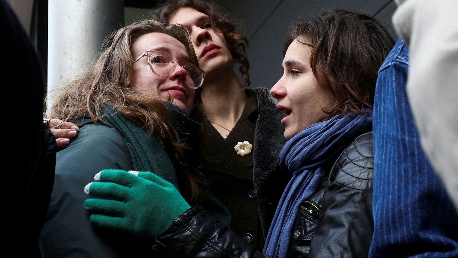 Environmental campaigners react outside the court after the hearing. /Yves Herman/Reuters
