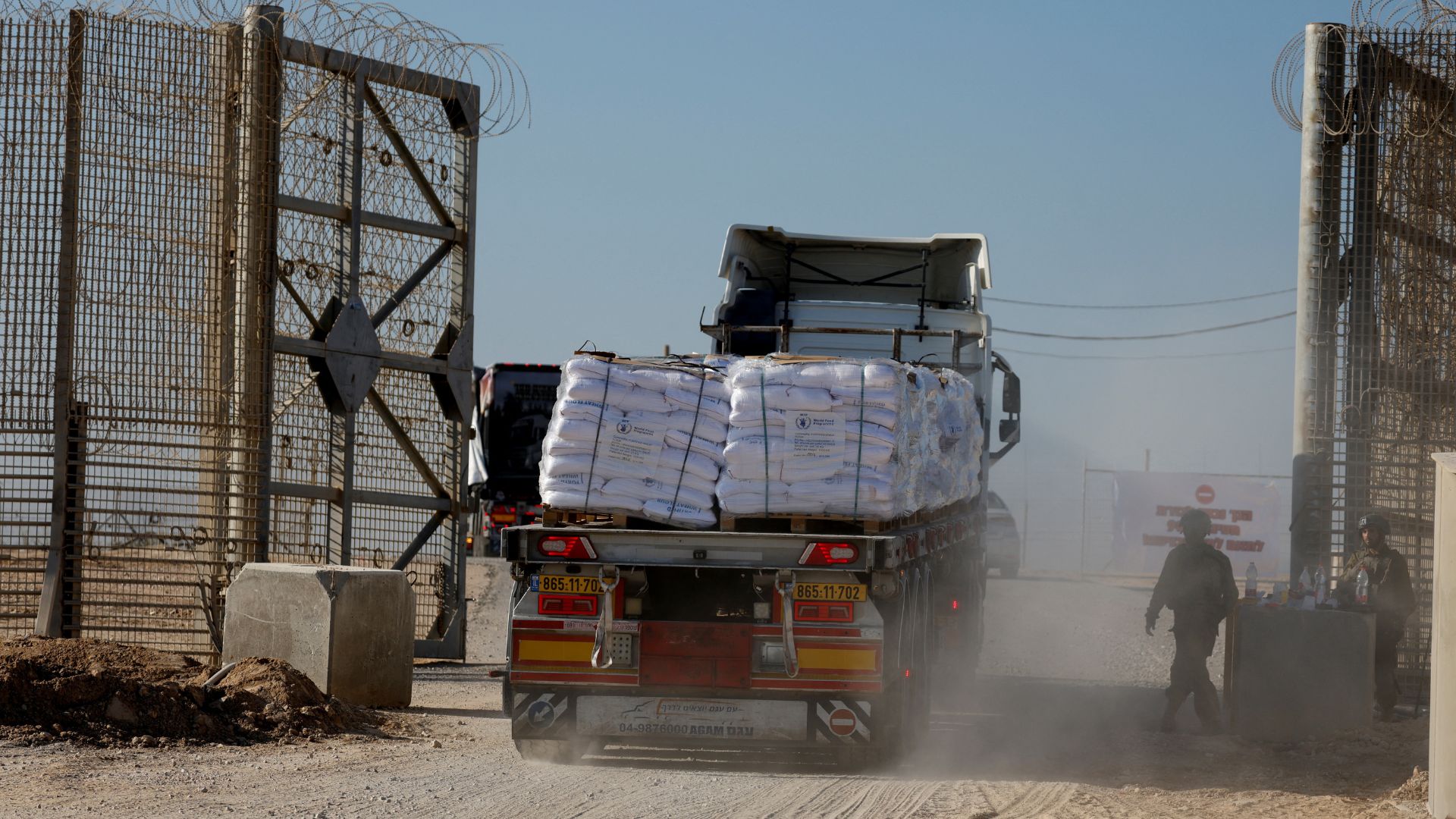 A truck carries humanitarian aid destined for the Gaza Strip at the Kerem Shalom crossing in southern Israel on November 11. /Amir Cohen/Reuters
