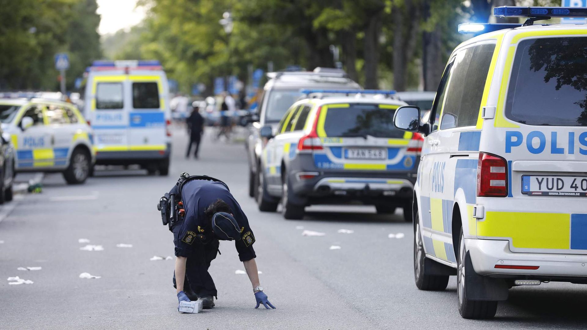 Police investigate at the scene of a shooting in Stockholm in June 2019. /Christine Olsson/TT News Agency
