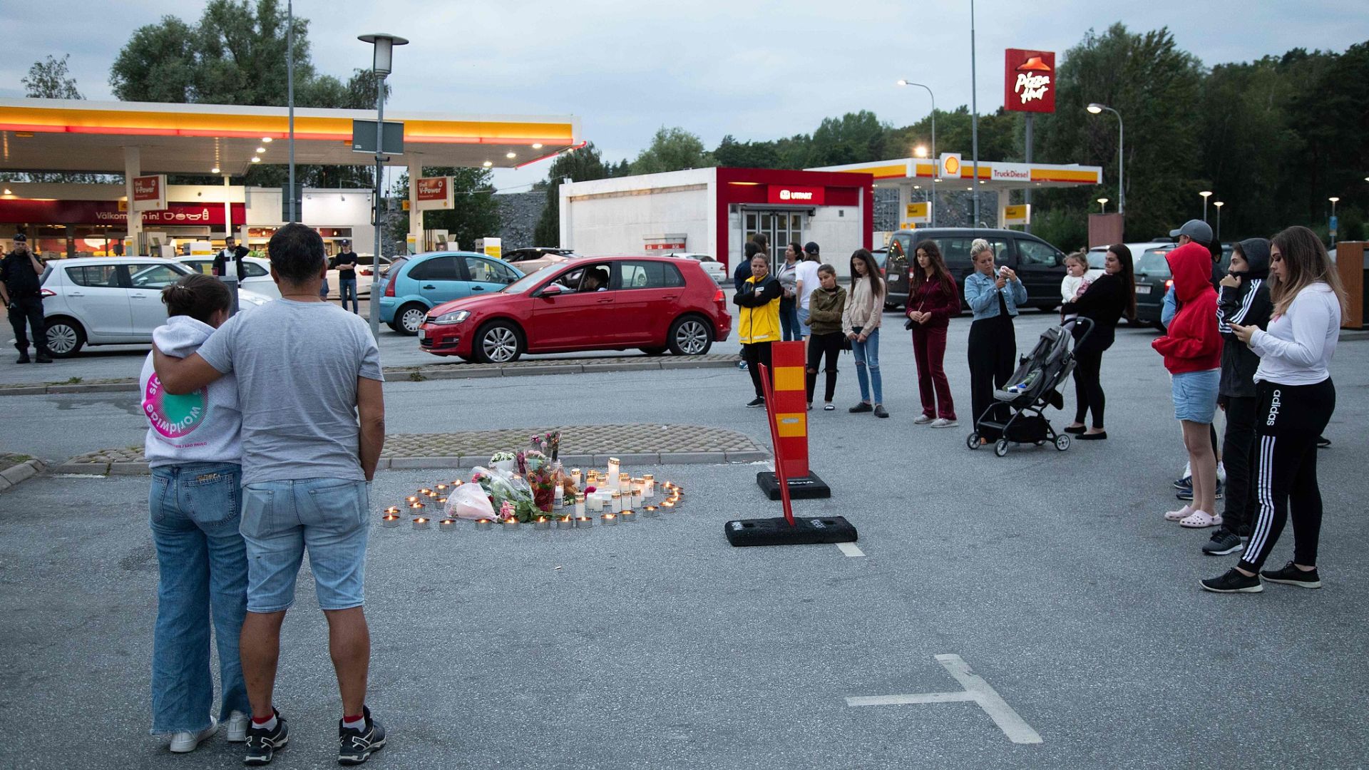 A memorial to a 12-year-old girl shot by a stray bullet from a gang fight while walking her dog in Stockholm in August 2020. /via CFP