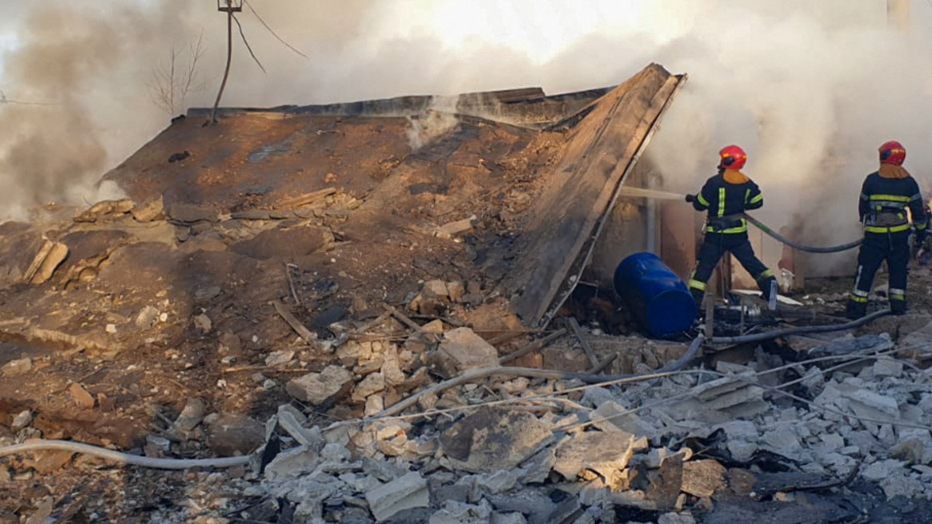 Firefighters work at the site of a residential area hit by a Russian missile strike. / Press service of the State Emergency Service of Ukraine in Lviv region/Handout