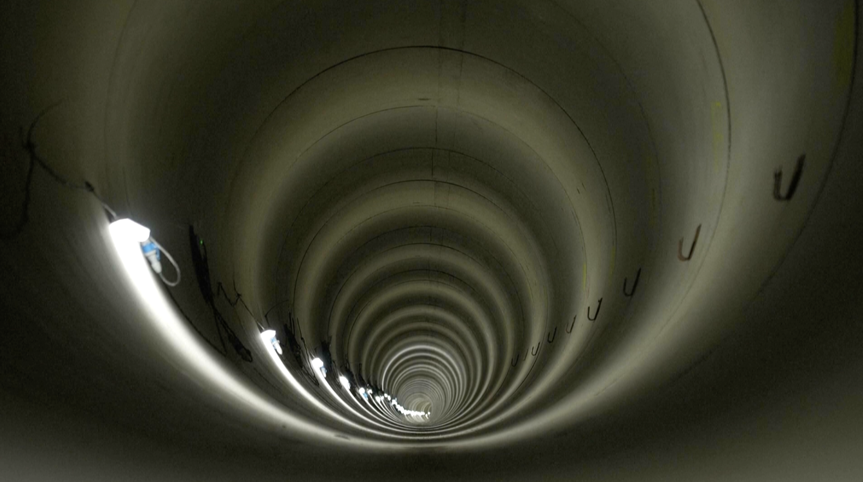 View of the tunnel lit with lanterns at intervals. /AP