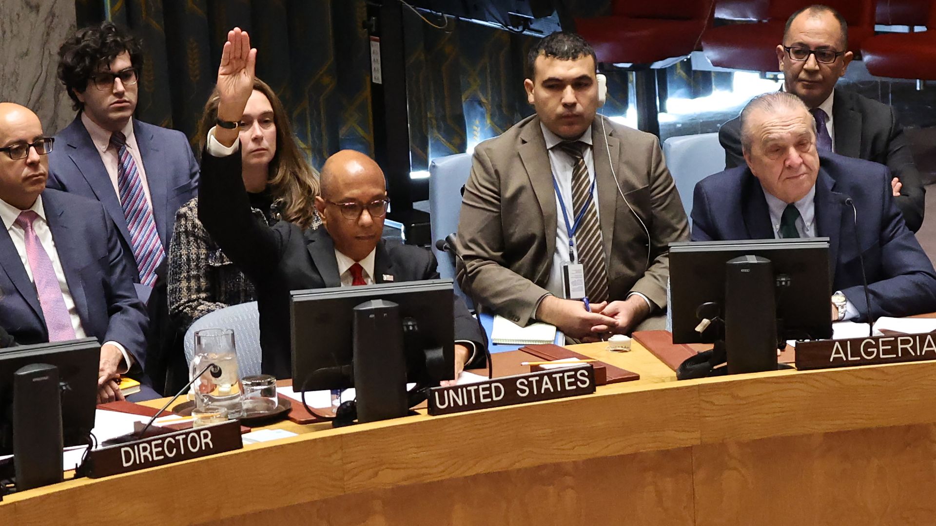 Ambassador Robert Wood, Alternate Representative of the U.S. for Special Political Affairs in the UN, raises his hands to veto the draft resolution. /Michael M. Santiago/Getty Images/AFP
