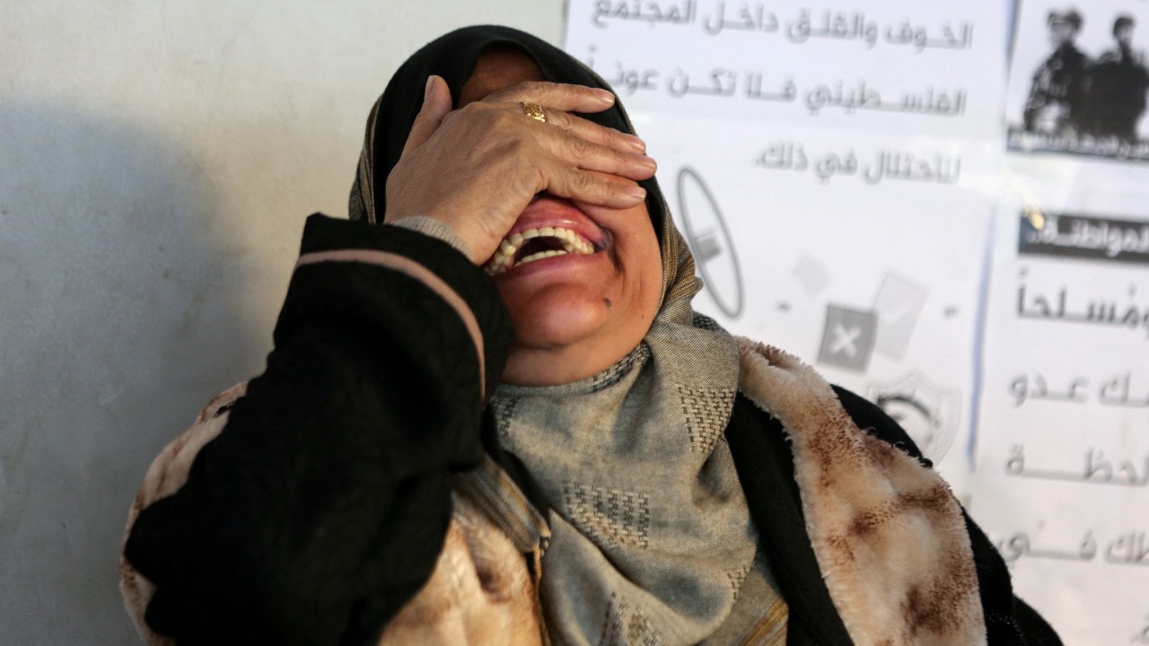 A woman reacts near the bodies of Palestinians killed in an Israeli strike (not pictured) in Gaza City. /Dawoud Abu Alkas/Reuters