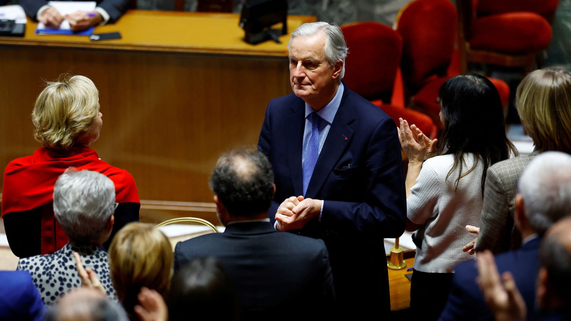 Barnier applauded by members of the outgoing French government during his ill-fated speech during the no-confidence debate. /Sarah Meyssonnier/Reuters
