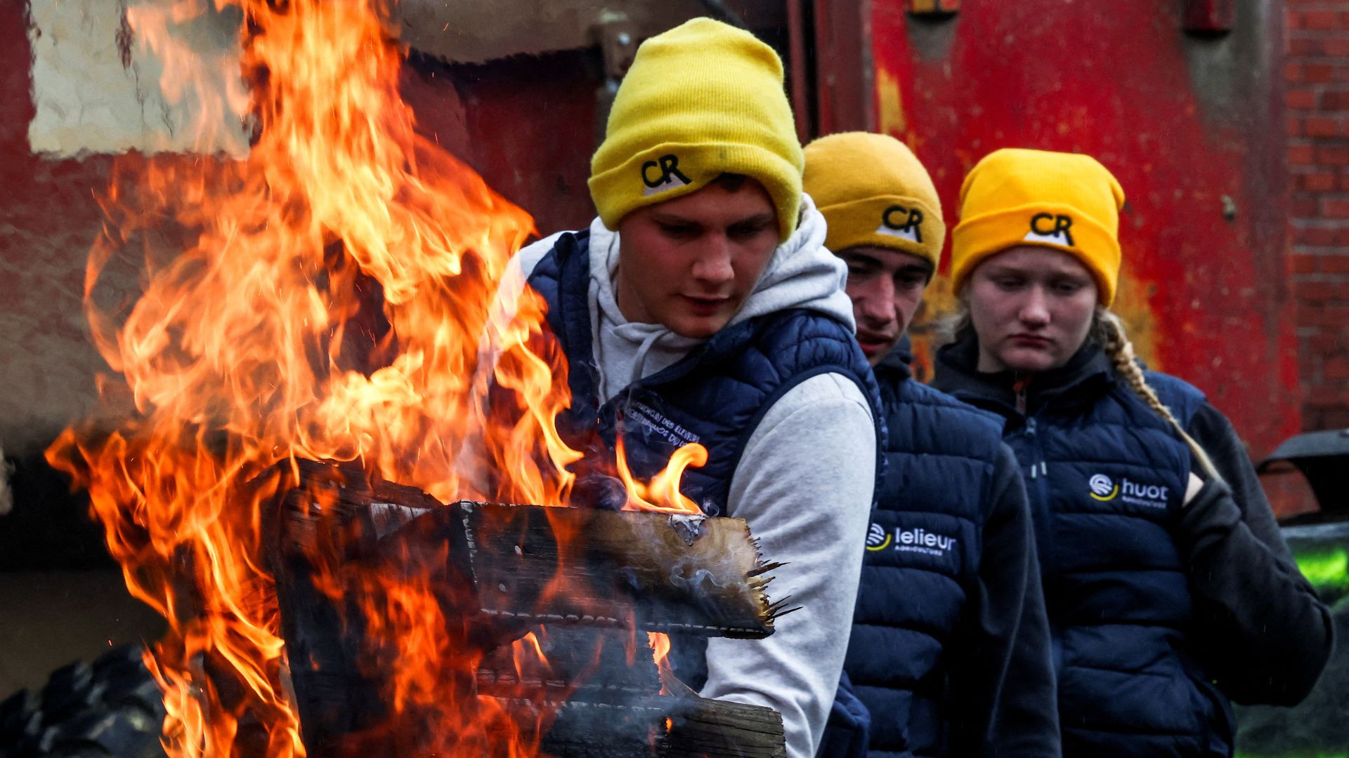 Farmers burn a wooden pallet to warm themselves during a recent protest against the EU-Mercosur Trade Agreement, in Strasbourg, France. /Yves Herman/Reuters
