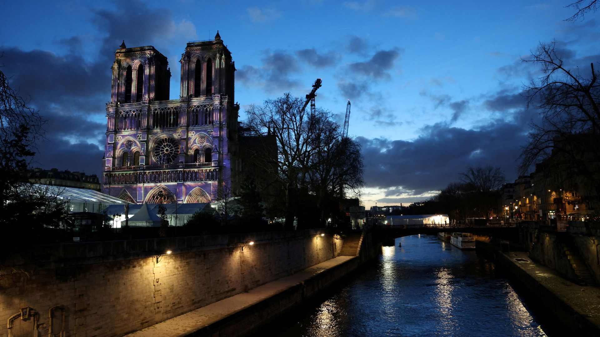 A light show rehearsal on the facade of the Notre-Dame, the night before Saturday's reopening ceremony. /Kevin Coombs/Reuters
