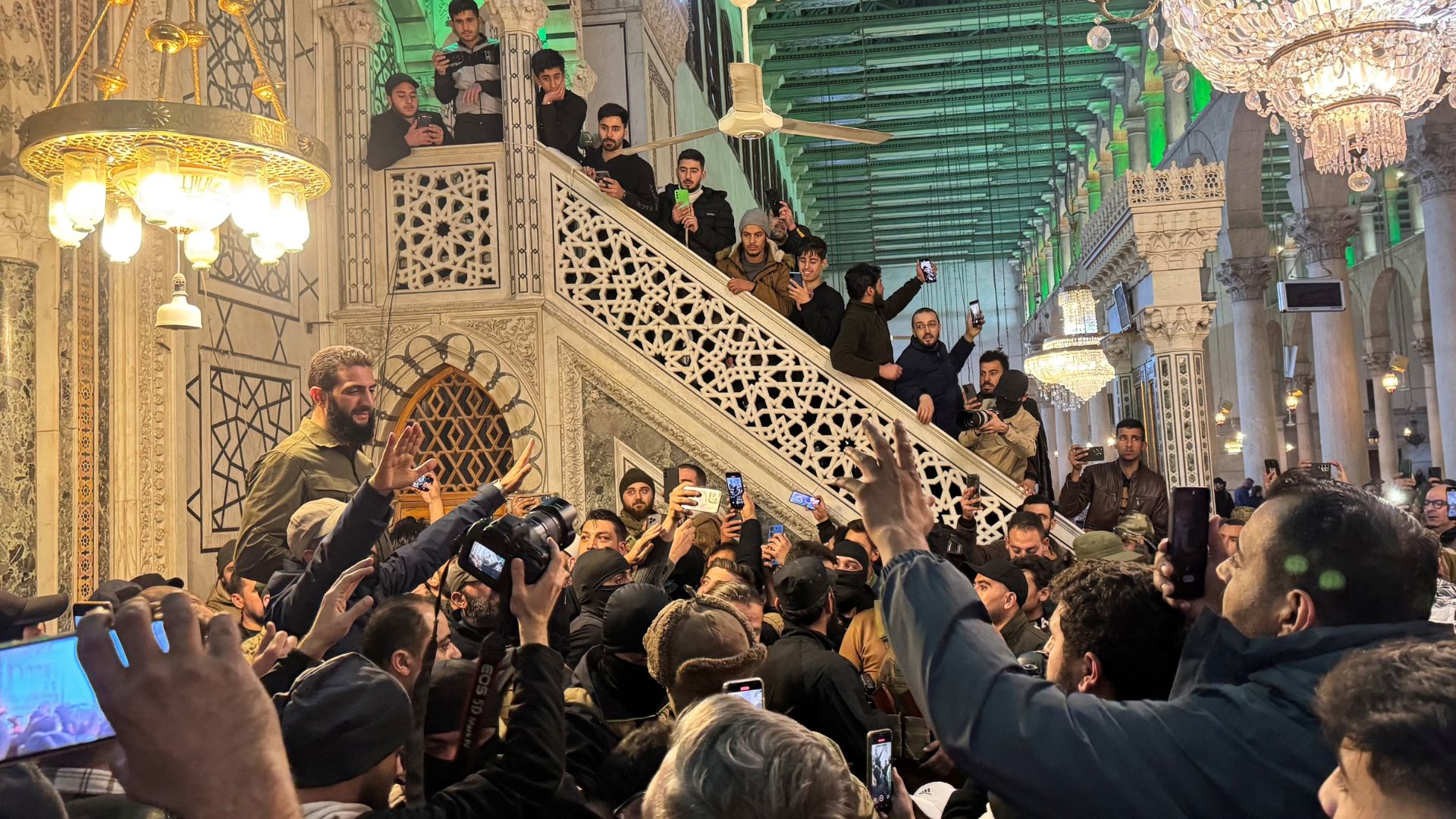 Rebel commander Abu Mohammed al-Golani speaks at Ummayad Mosque in Damascus on Sunday.  /Mahmoud Hassano/Reuters