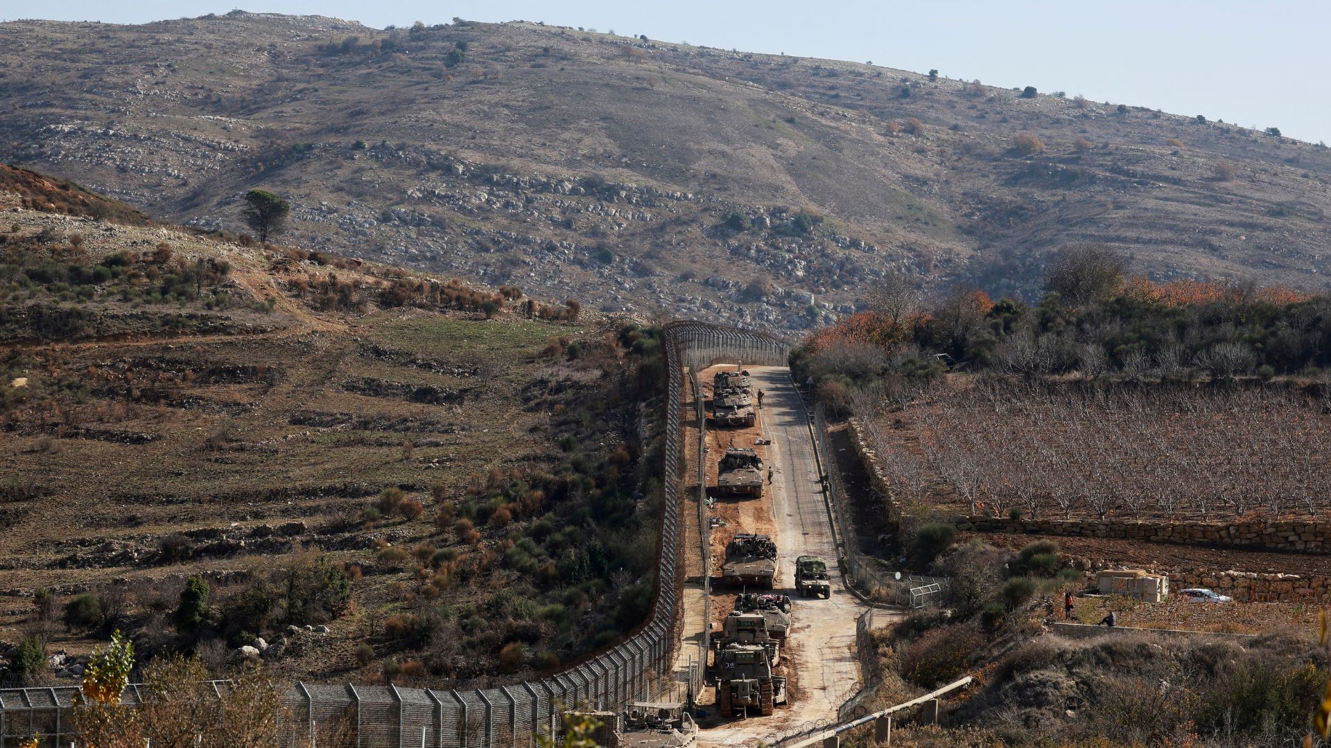 Israeli military vehicles gather near the ceasefire line between Syria and the Israeli-occupied Golan Heights on Monday. /Ammar Awad/Reuters