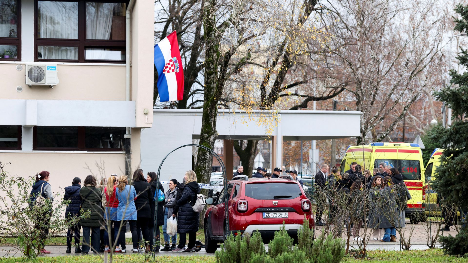 People stand near an ambulance, following the attack. /Antonio Bronic/Reuters