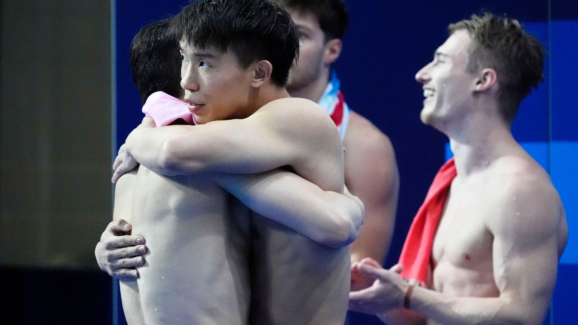 China pair Daoyi Long and Zongyuan Wang celebrate after winning gold in the men;s synchronized 3m springboard final. /Katie Goodale-USA TODAY Sports