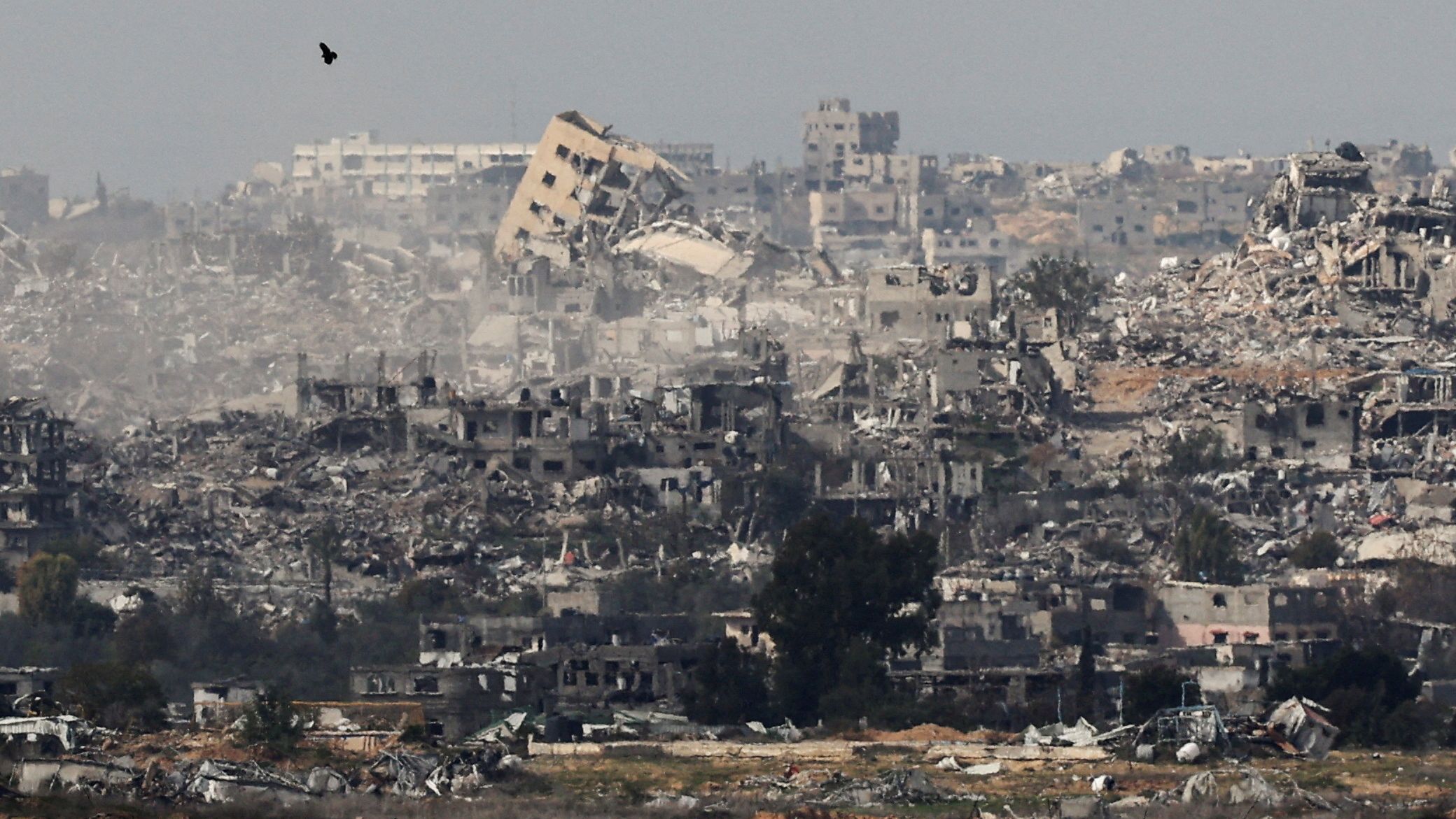 Ruined buildings in Beit Hanoun in the Gaza Strip, seen from southern Israel. /Kai Pfaffenbach/Reuters