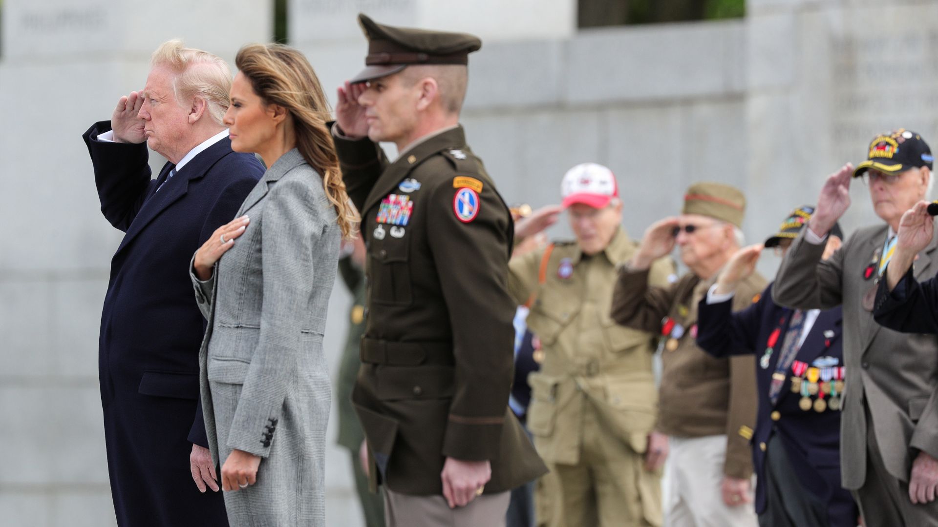 U.S. President Donald Trump and first lady Melania Trump join veterans in a salute during a Victory in Europe Day 75th anniversary ceremony in 2020. /Tom Brenner/Reuters
